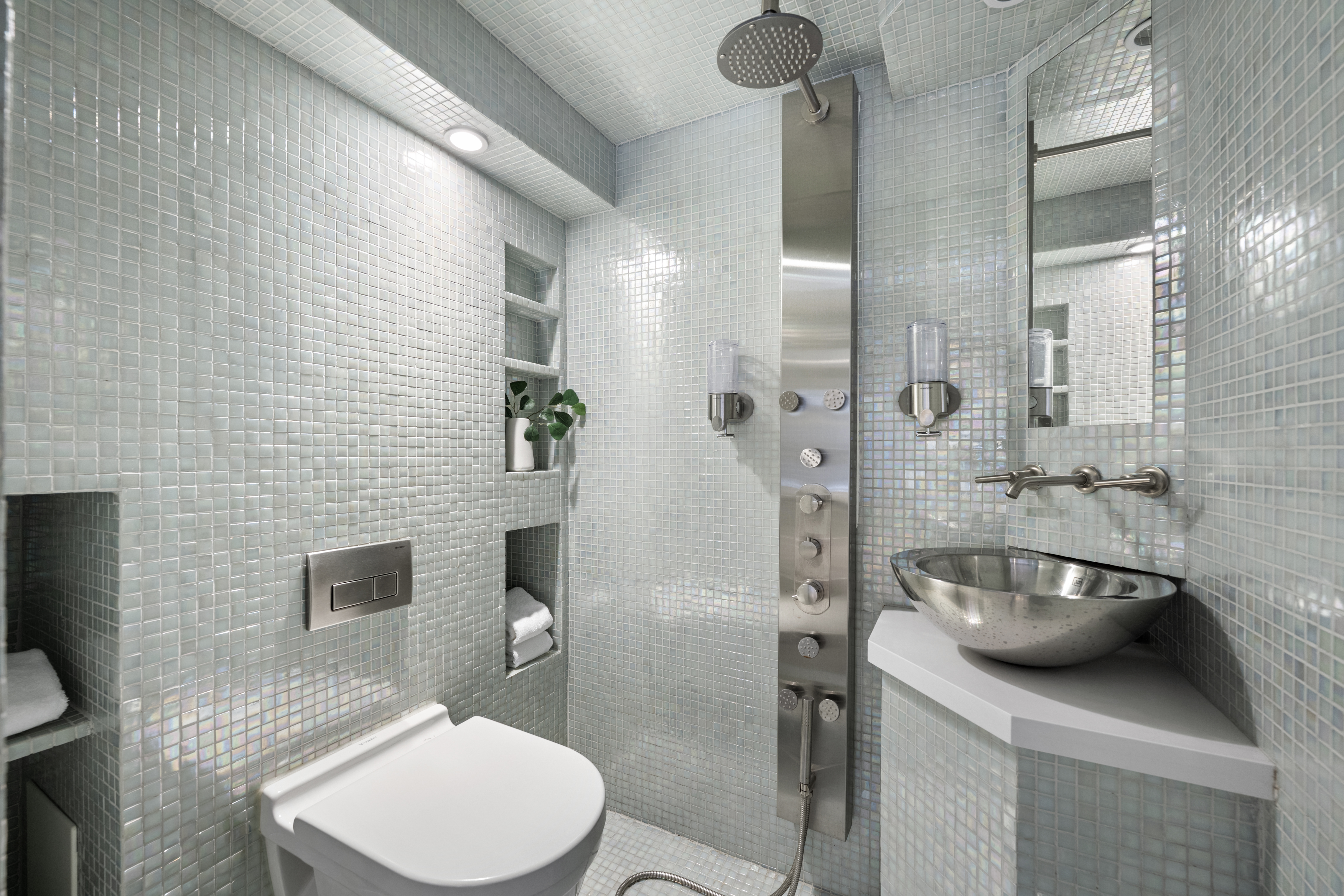 253 West 73rd Street, Unit 6B-C Manhattan, NY 10023 - Photo 15 of 21 a bathroom with a sink a toilet and shower