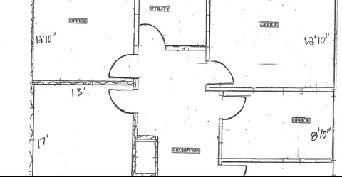 a picture of a bathroom with a shower