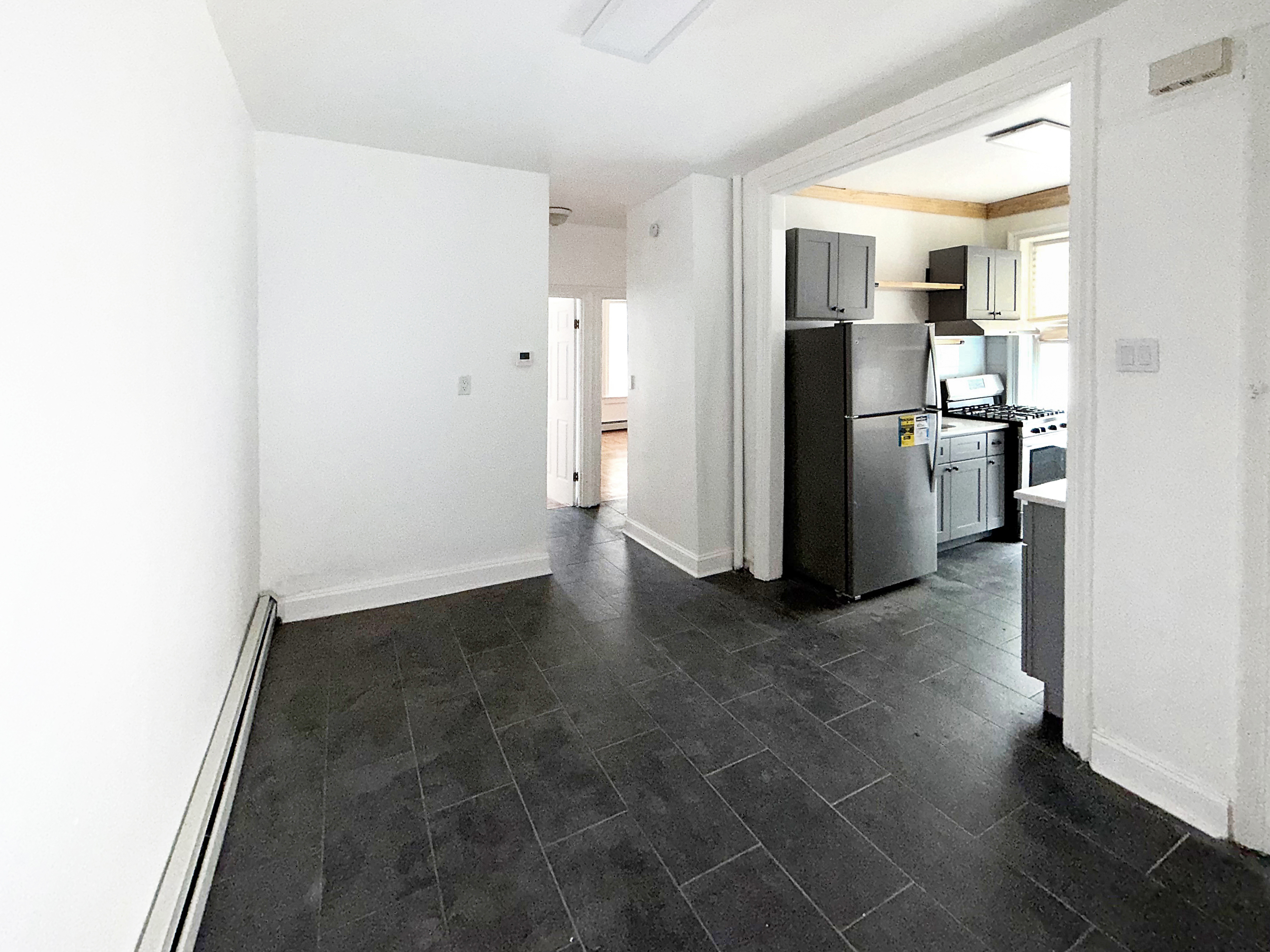 319 East 49th Street, Unit 1 Brooklyn, NY 11203 - Photo 2 of 8 a view of a kitchen with a sink