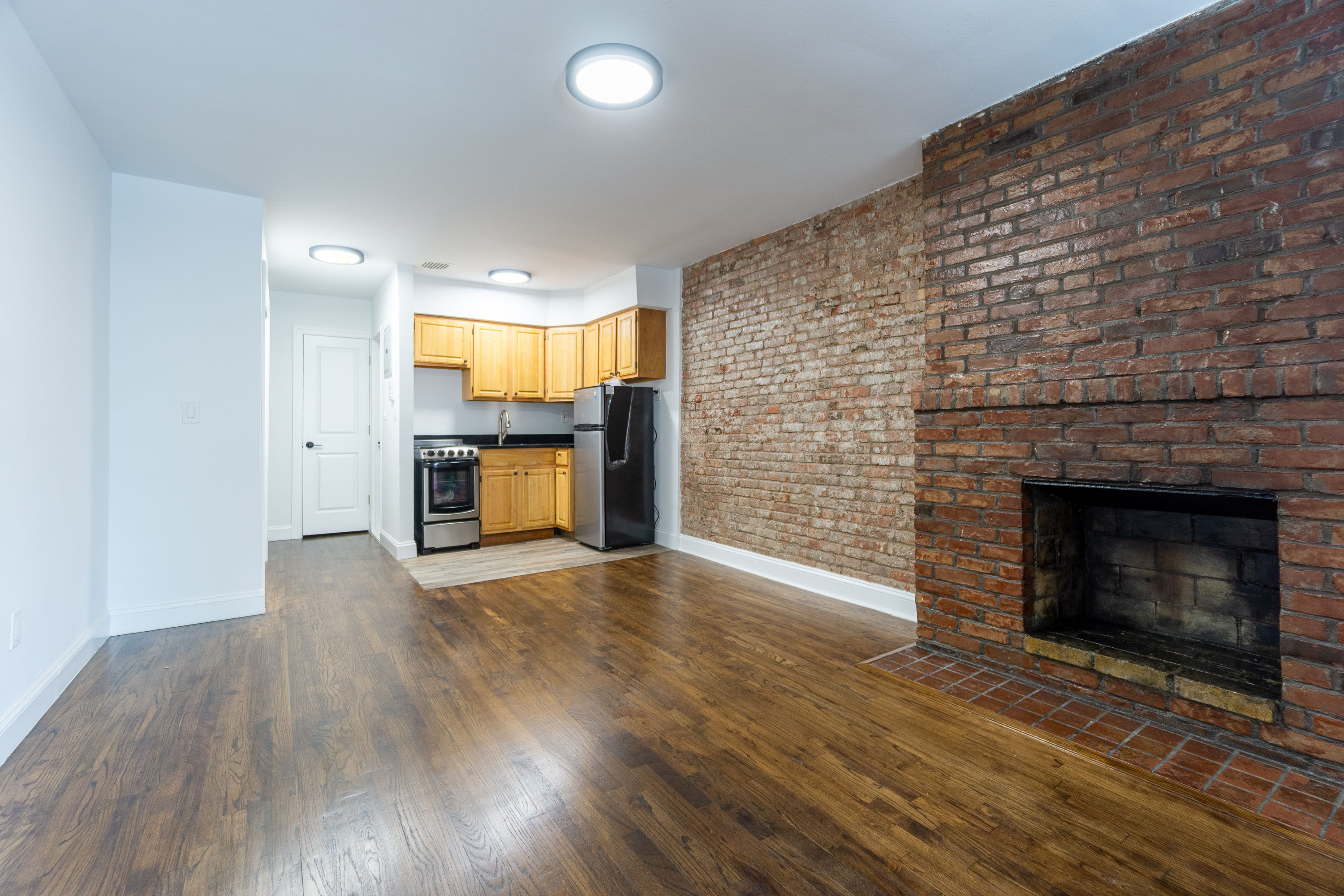 205 2nd Avenue, Unit 3B Manhattan, NY 10003 - Photo 6 of 9 a view of a livingroom with a fireplace