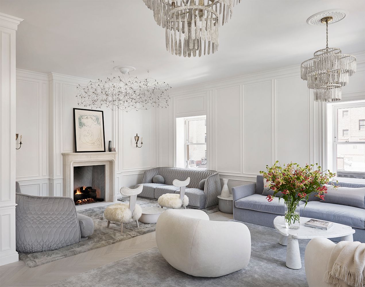 a living room with furniture fireplace and window