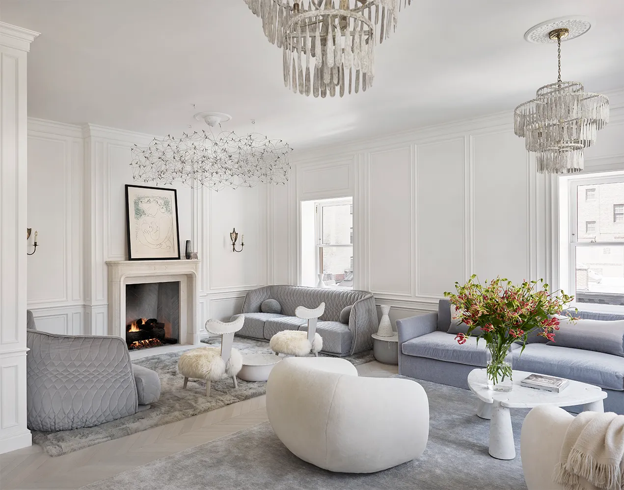 a living room with furniture fireplace and window