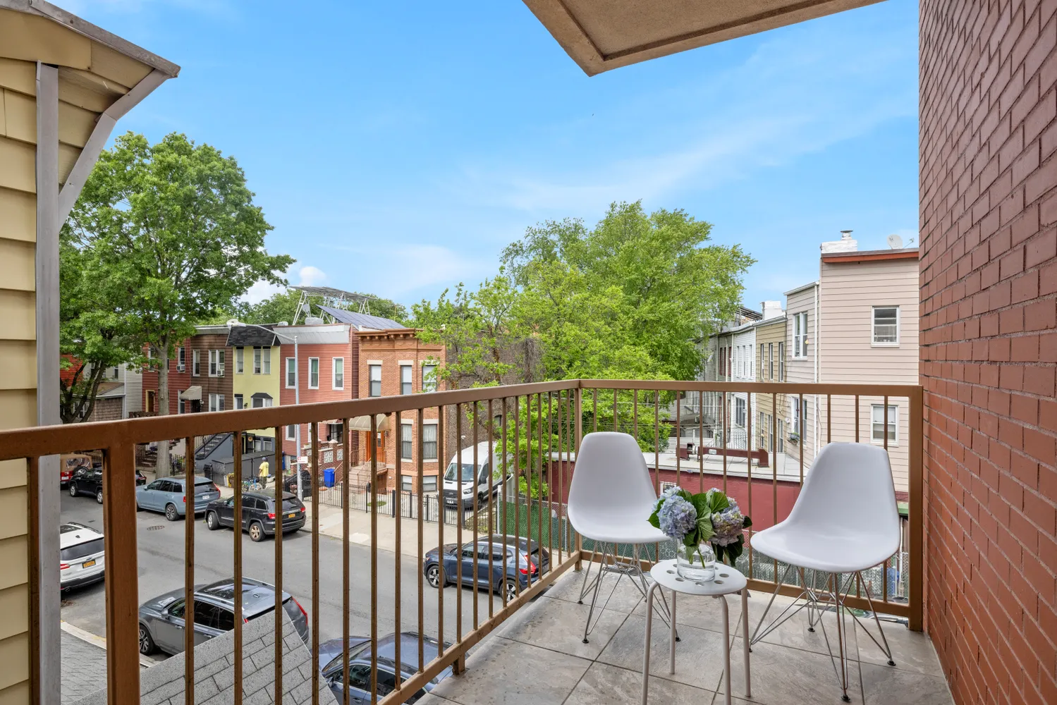 a view of a balcony with furniture