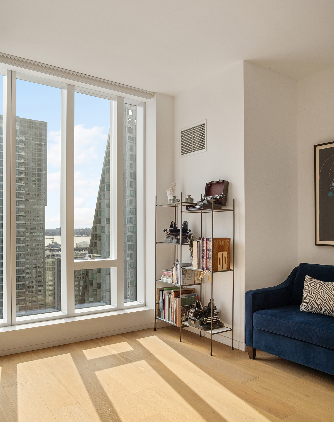 1 West End Avenue, Unit 22E Manhattan, NY 10023 - Photo 9 of 32 a view of a livingroom with lounge chair and a large window