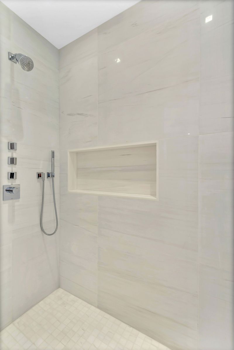 1 West End Avenue, Unit 27D Manhattan, NY 10023 - Photo 7 of 21 a bathroom with a shower