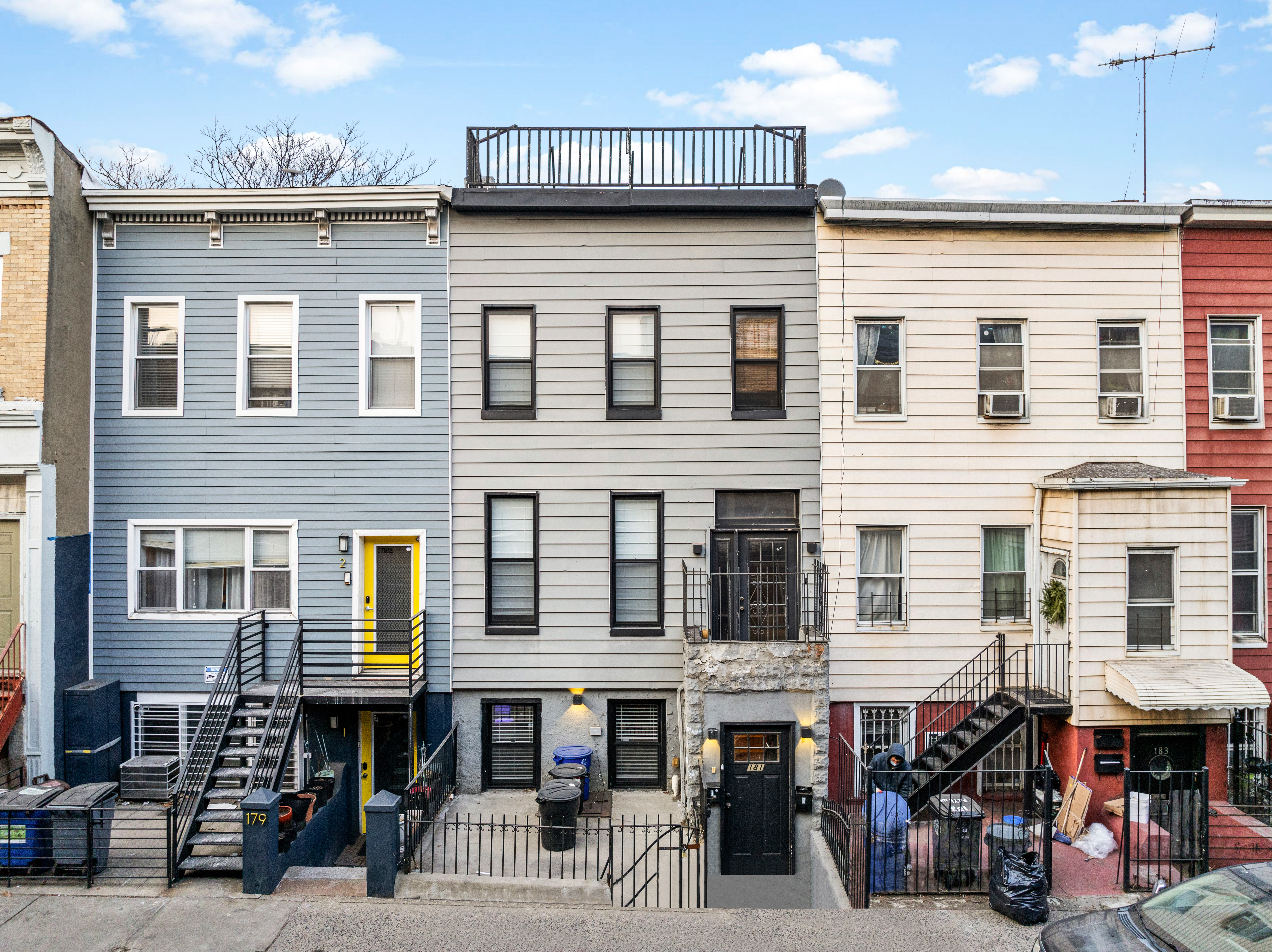 a group of people sitting in front of a building