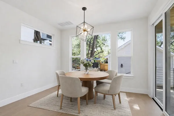 a dining room with furniture and window