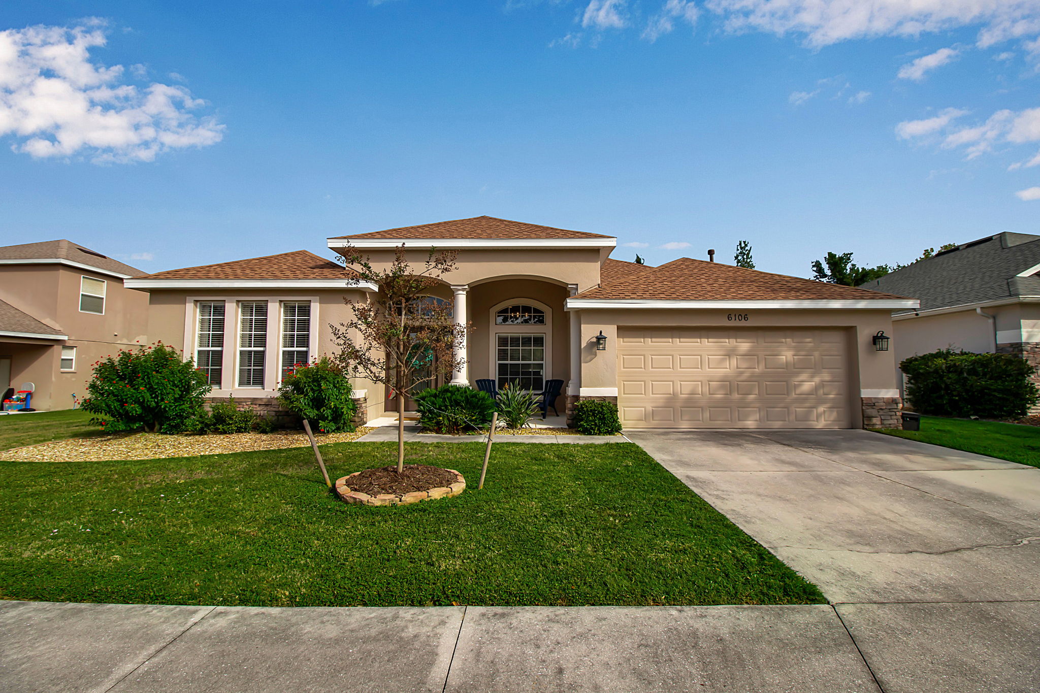 6106 34th Court East Bradenton, FL 34203 - Photo 9 of 69 a front view of a house with a yard