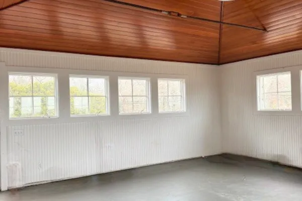 a view of an empty room with a window