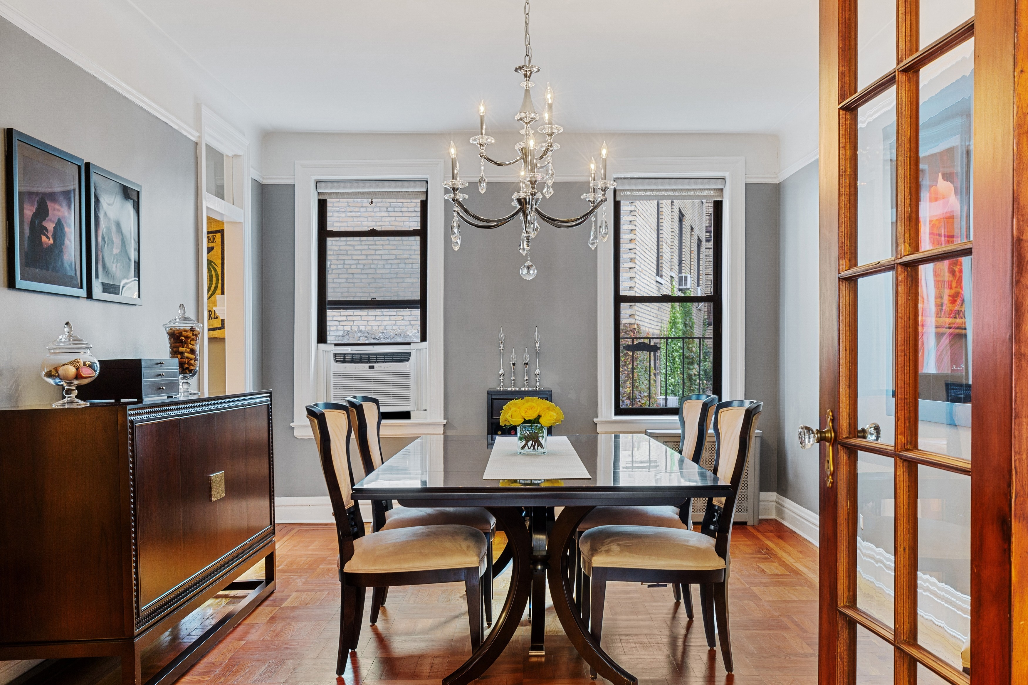 125 Cabrini Boulevard, Unit A52 Manhattan, NY 10033 - Photo 4 of 20 a view of a dining room with furniture window and wooden floor