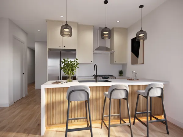 a kitchen with stainless steel appliances granite countertop a sink a stove a refrigerator and island with wooden floor