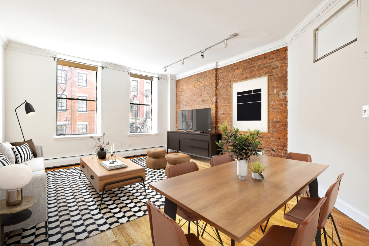 231 East 13th Street, Unit 6E Manhattan, NY 10003 - Photo 2 of 9 a living room with furniture floor to ceiling window and wooden floor