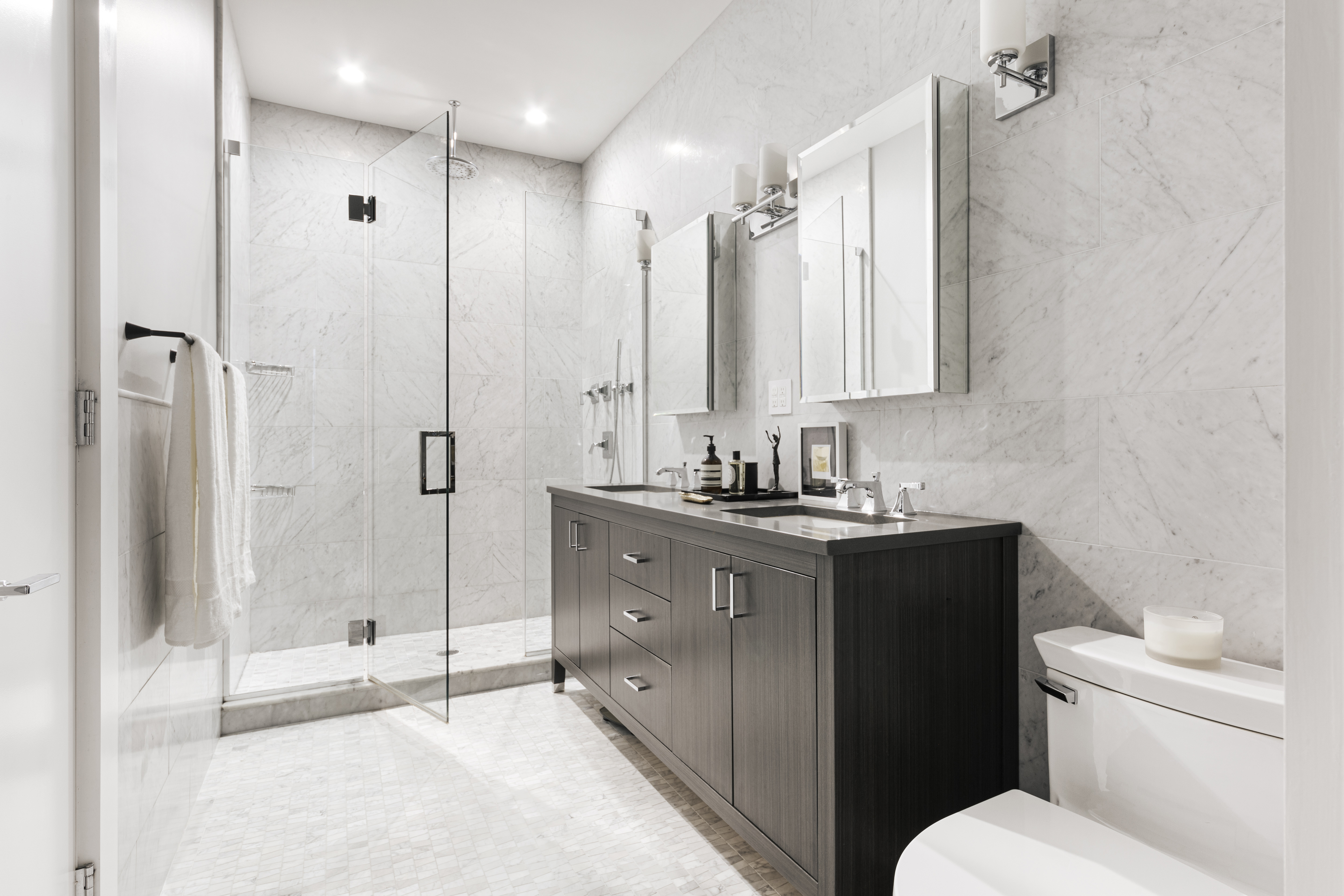 320 West 115th Street Manhattan, NY 10026 - Photo 4 of 11 a bathroom with a double vanity sink toilet and shower