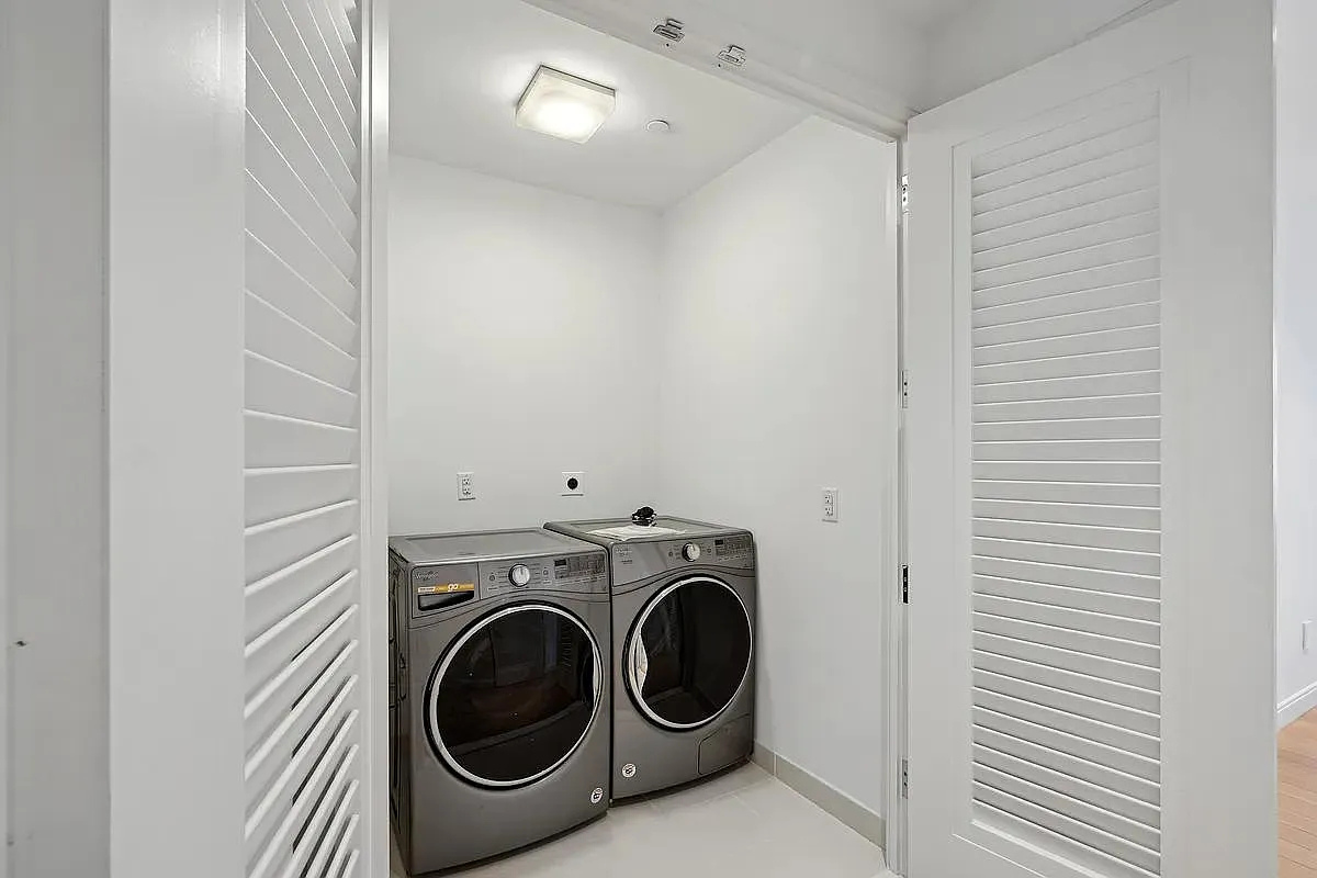 269 West 87th Street, Unit 9B Manhattan, NY 10024 - Photo 12 of 23 a utility room with dryer and washer