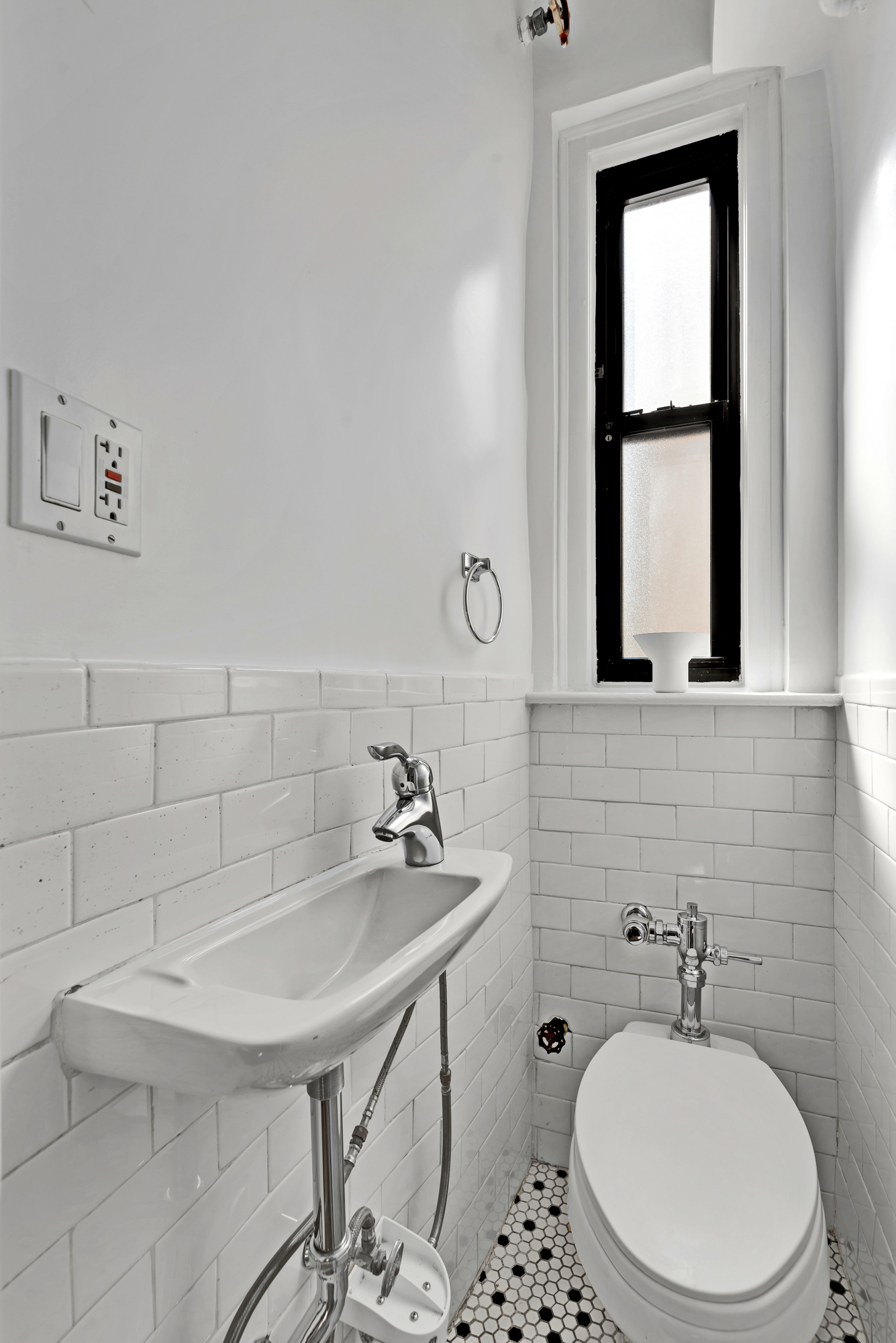 41 West 96th Street, Unit 15D Manhattan, NY 10025 - Photo 9 of 13 a bathroom with a sink a toilet and mirror