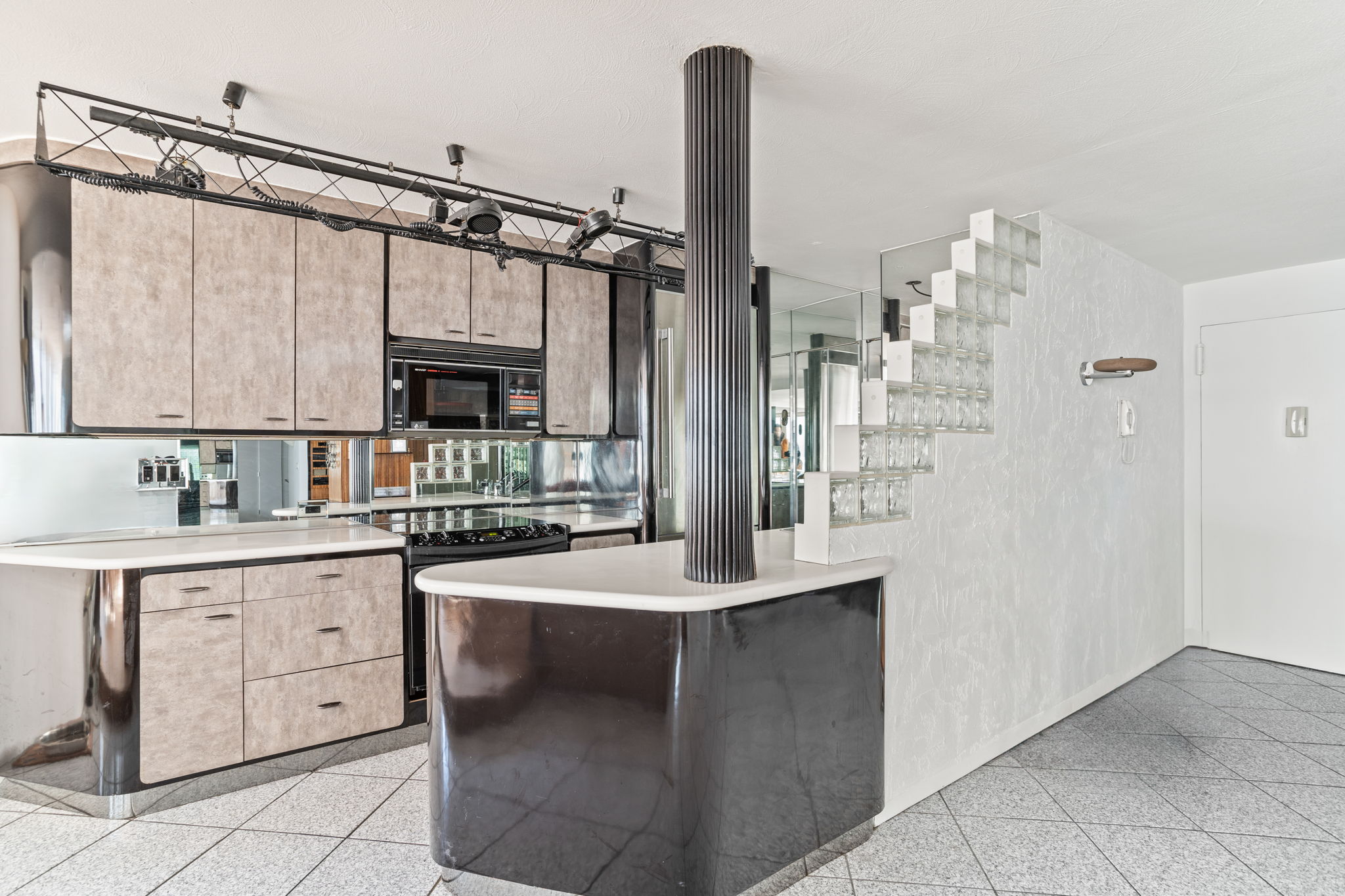 363 East 76th Street, Unit 2F Manhattan, NY 10075 - Photo 5 of 21 a kitchen with cabinets and white appliances