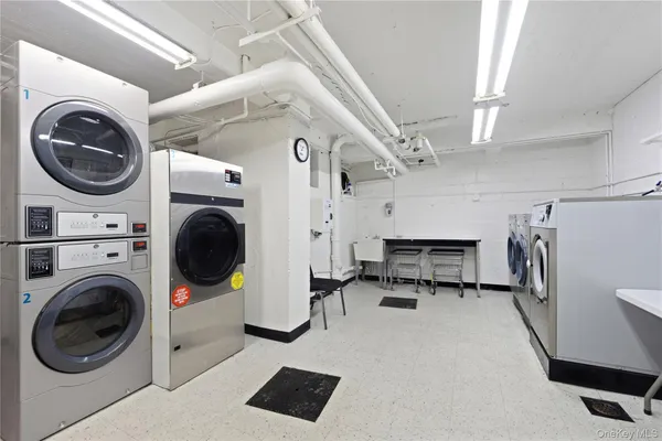a view of livingroom with washer and dryer