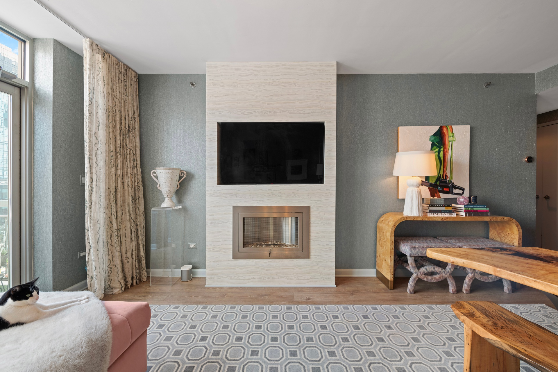 26 Broadway, Unit 602 Brooklyn, NY 11249 - Photo 4 of 12 a living room with furniture and a flat screen tv