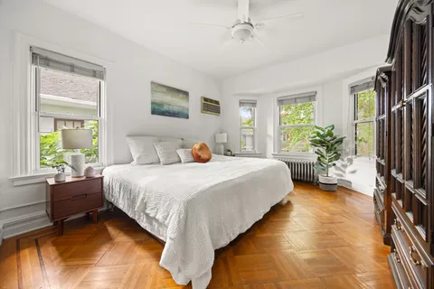 a bedroom with a bed furniture and a window