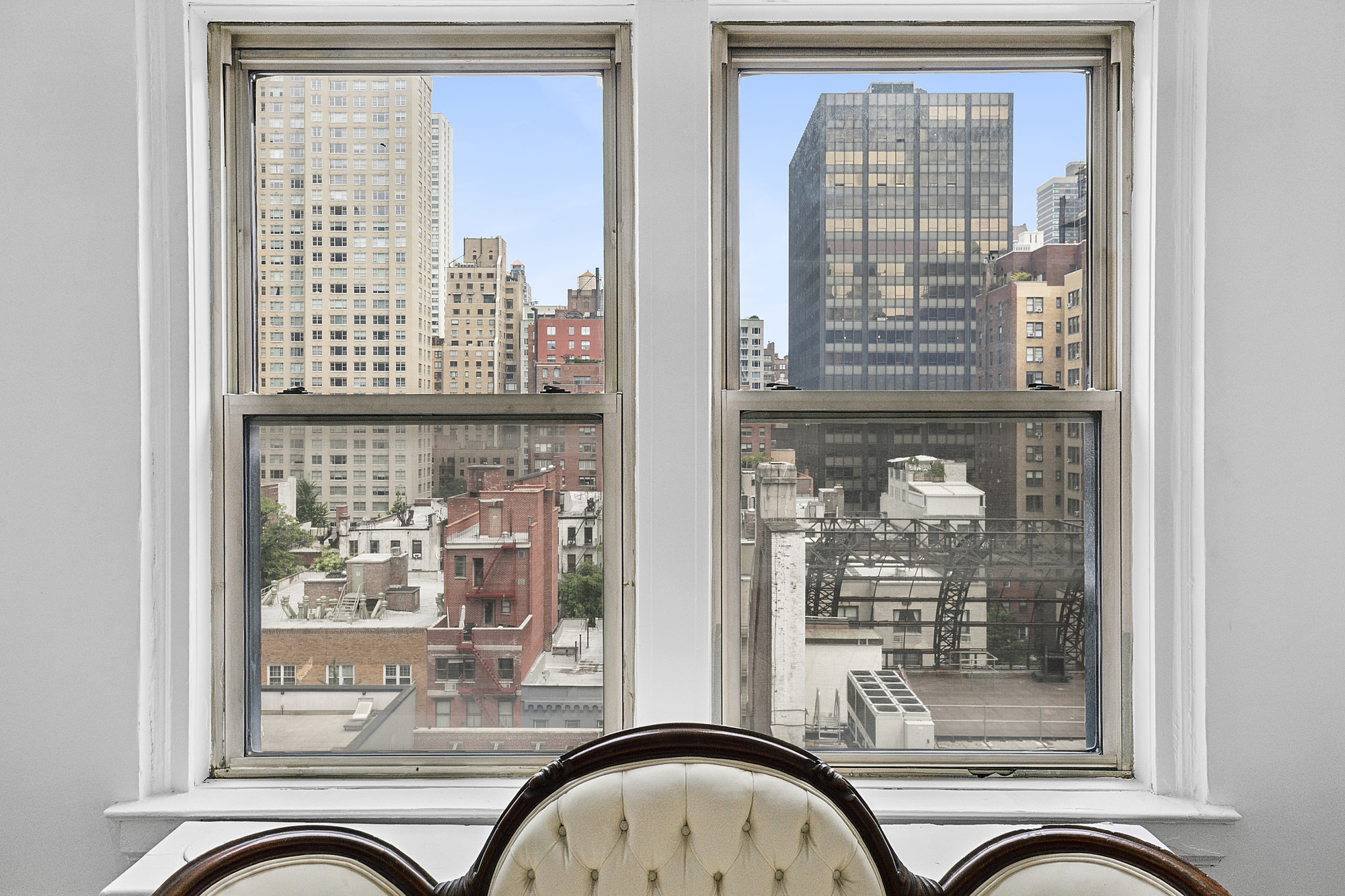 333 East 53rd Street, Unit 12L Manhattan, NY 10022 - Photo 2 of 9 a front view of a house with a glass door