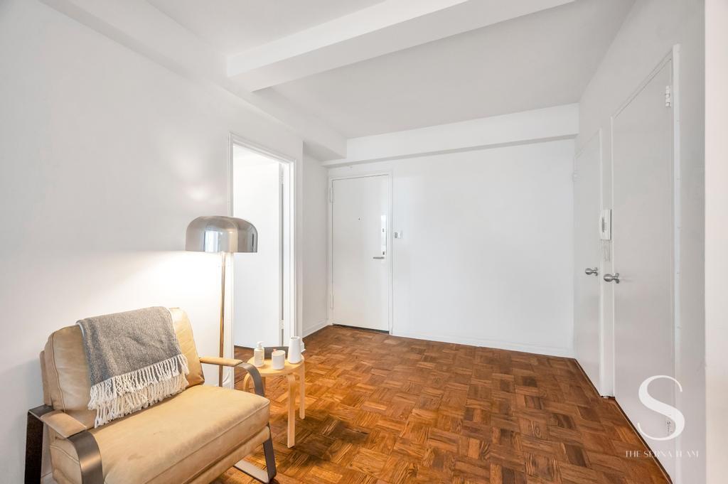 7 Lexington Avenue, Unit 5E Manhattan, NY 10010 - Photo 11 of 27 a bedroom with a bed and a lamp