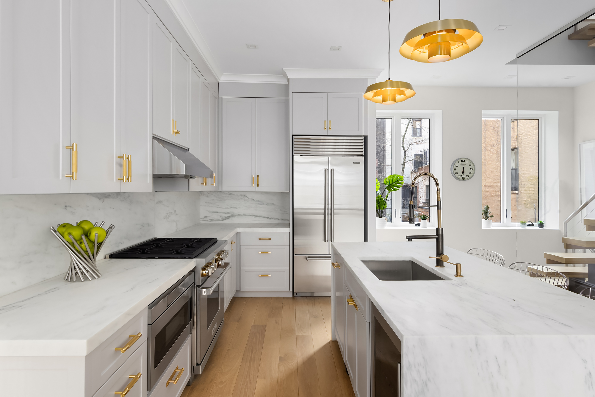 130 East 38th Street Manhattan, NY 10016 - Photo 5 of 16 a kitchen filled with stainless steel appliances granite countertop a sink a stove and a refrigerator