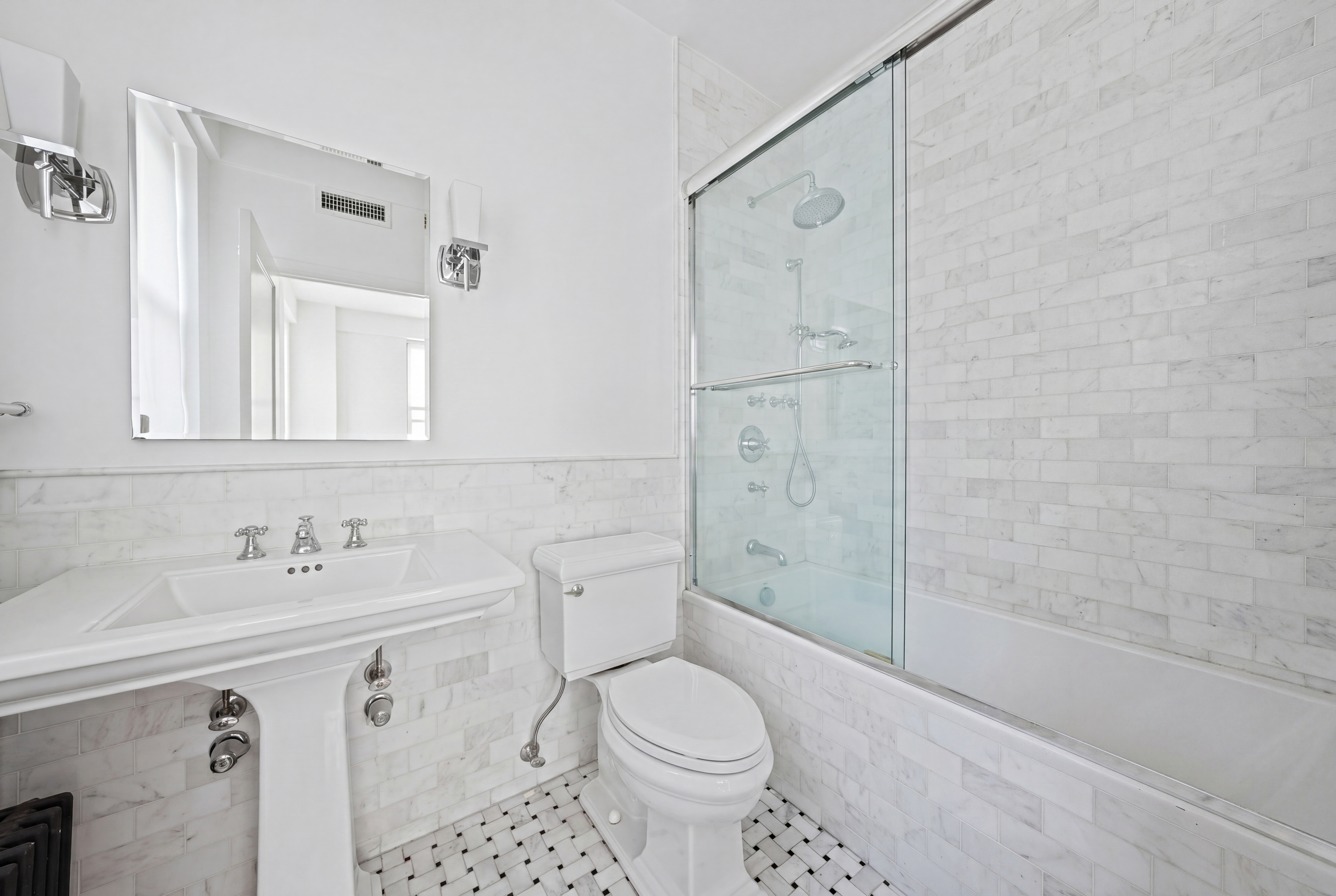 177 East 77th Street, Unit PHC Manhattan, NY 10075 - Photo 18 of 26 a bathroom with a sink toilet and shower