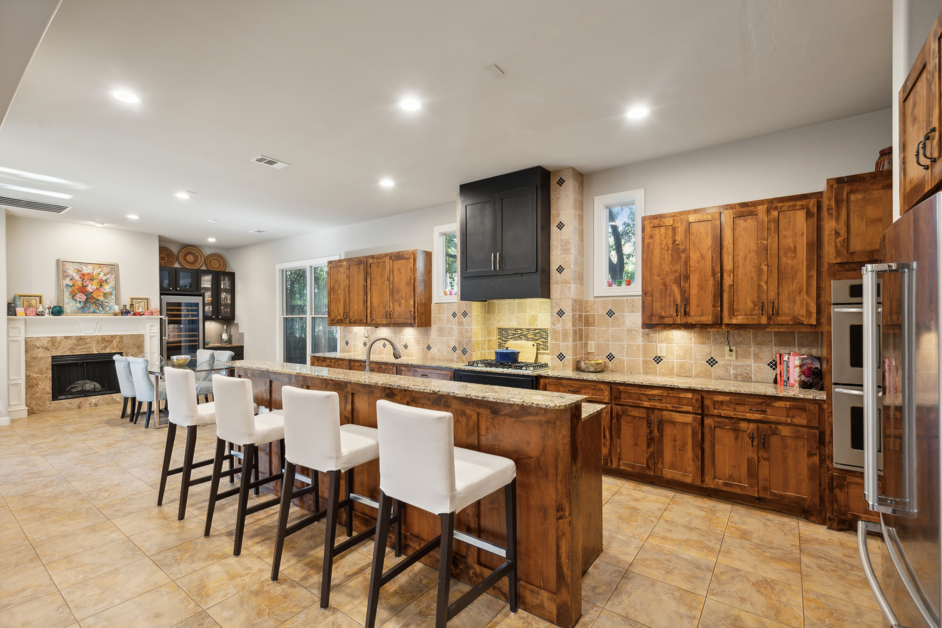 8411 Midway Road Dallas, TX 75209 - Photo 12 of 29 a large kitchen with a table and chairs