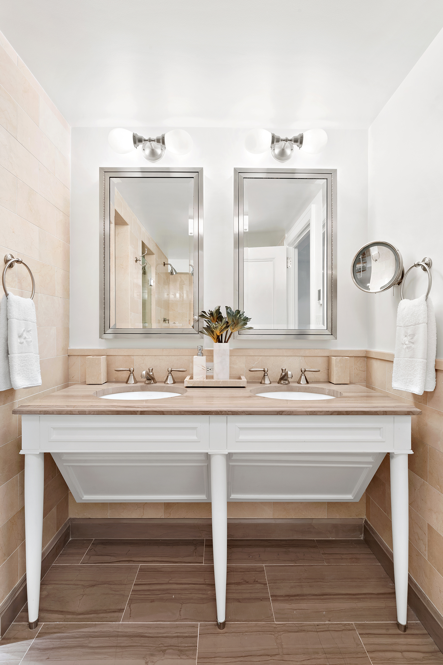 530 Park Avenue, Unit 2F Manhattan, NY 10065 - Photo 15 of 19 a bathroom with a sink and a mirror