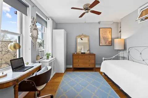 a bedroom with a bed and furniture