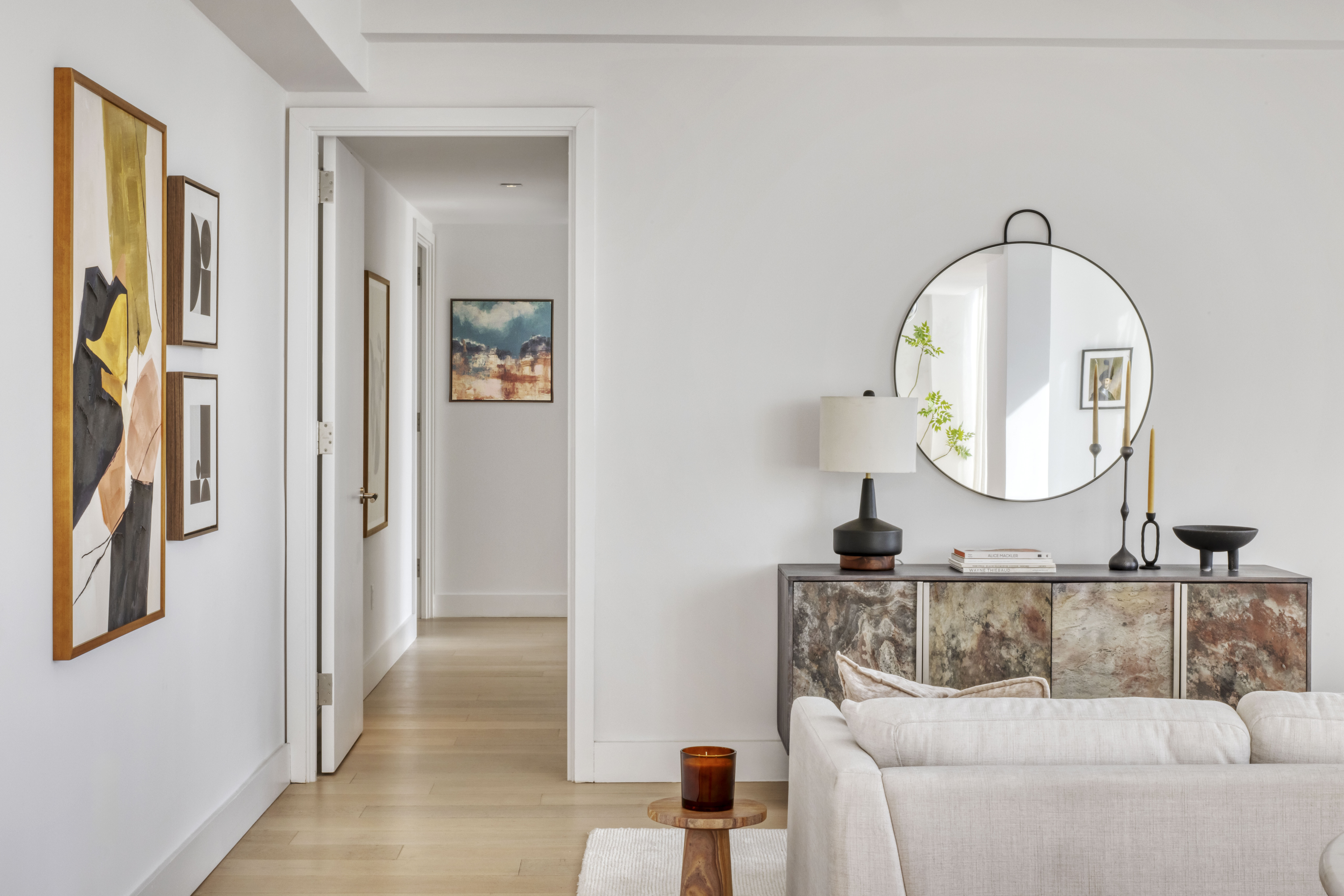 251 1st Street, Unit PH8D Brooklyn, NY 11215 - Photo 5 of 14 a living room with furniture and a mirror