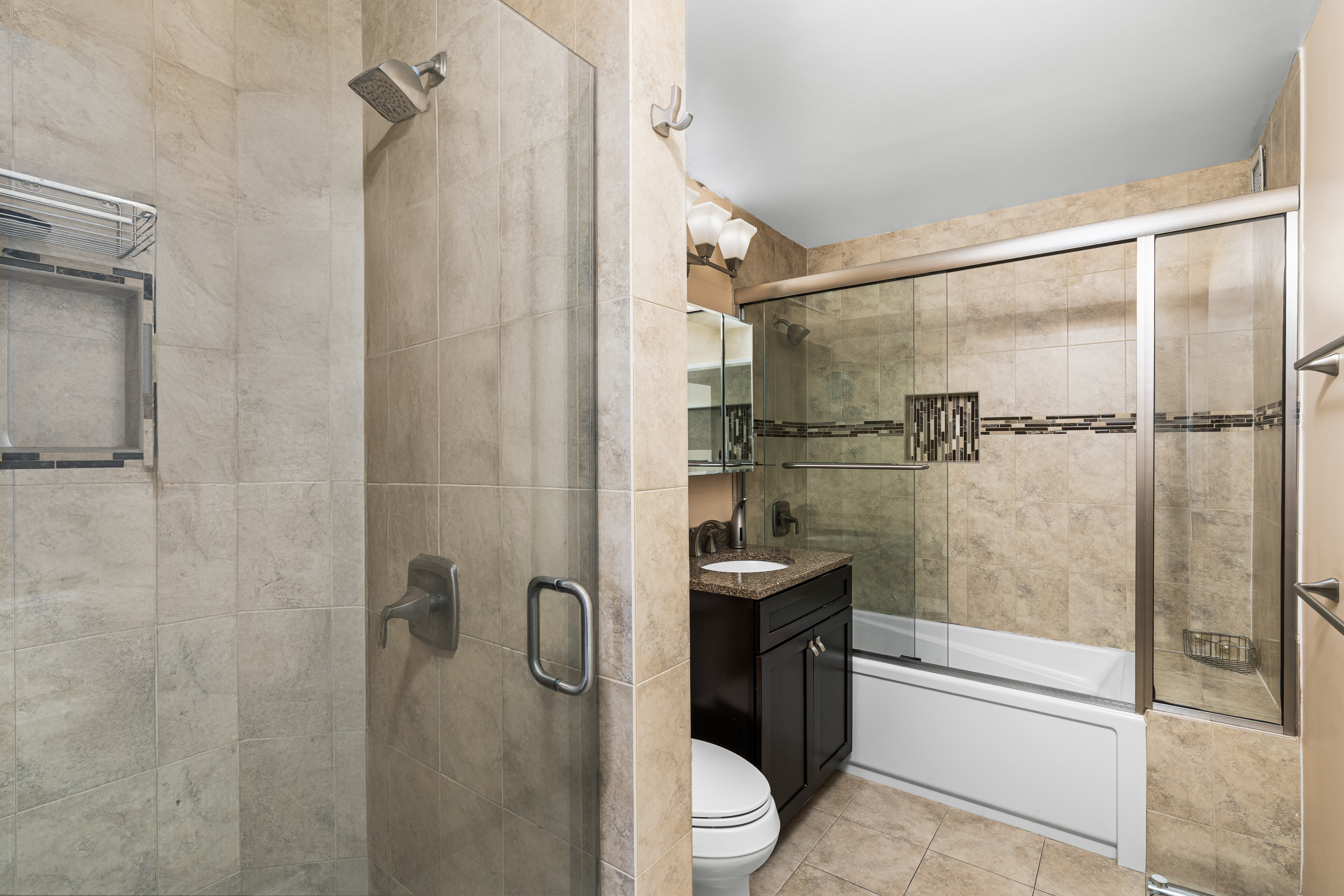 112-01 Queens Boulevard, Unit 6J Queens, NY 11375 - Photo 11 of 29 a bathroom with a shower and a toilet