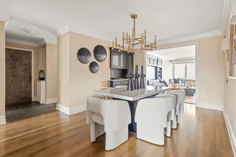 a view of dining room and hall with wooden floor
