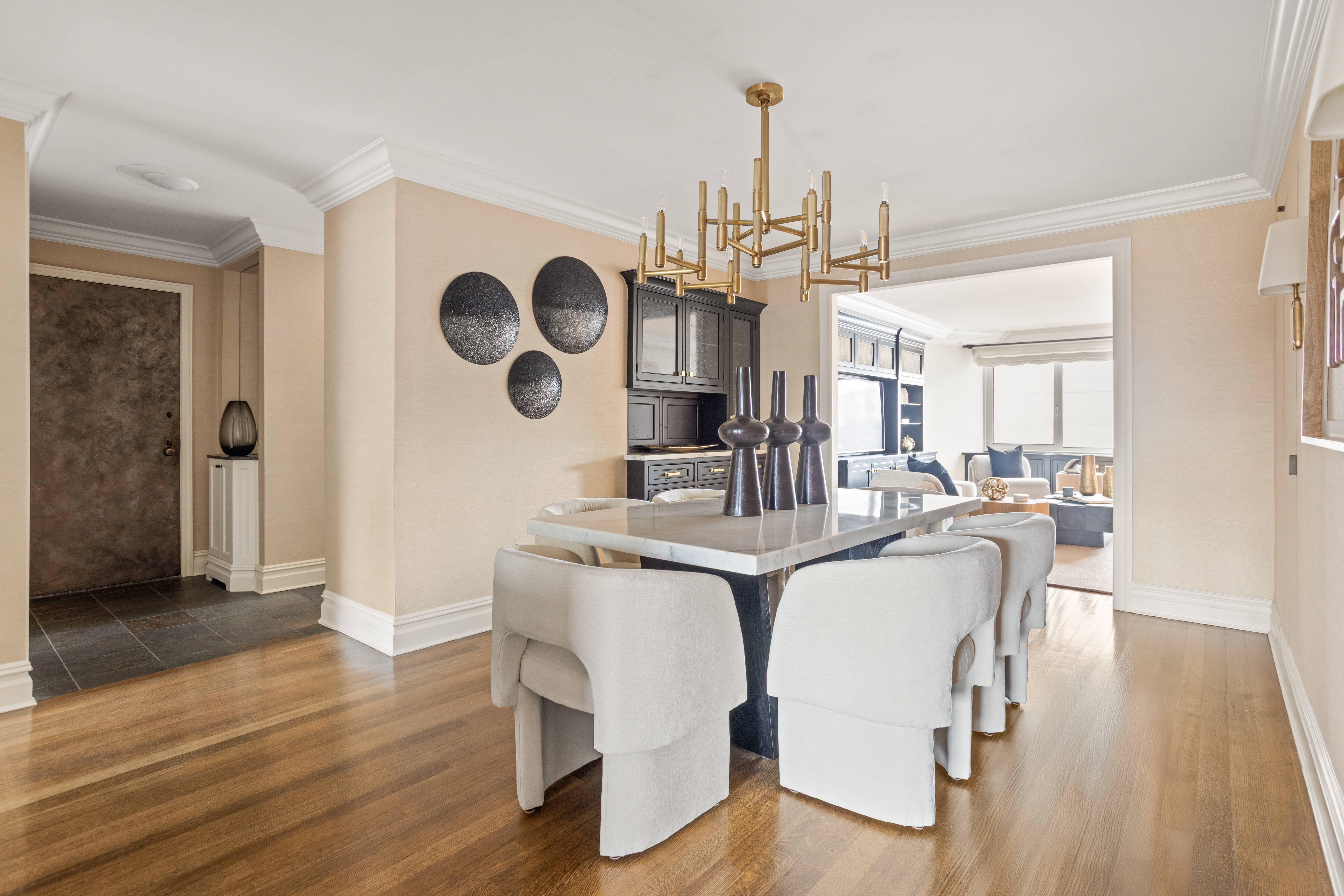 60 East End Avenue, Unit 12C Manhattan, NY 10028 - Photo 3 of 27 a view of dining room and hall with wooden floor