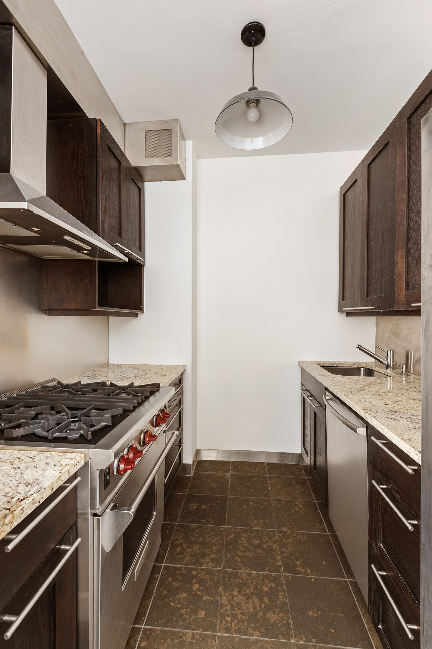 60 East 8th Street, Unit 14L Manhattan, NY 10003 - Photo 2 of 6 a kitchen with a stove and a sink