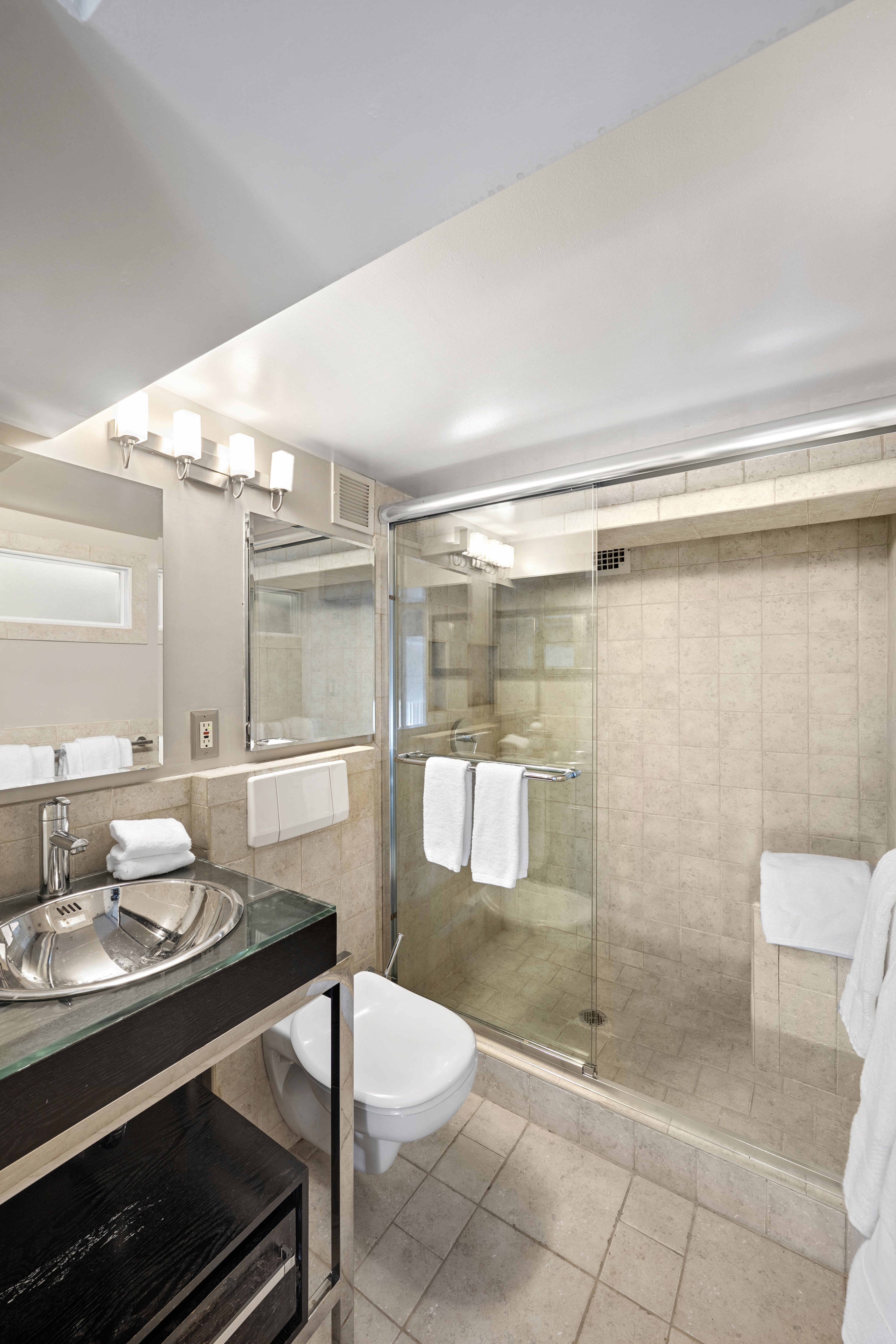 253 West 73rd Street, Unit 6B-C Manhattan, NY 10023 - Photo 17 of 21 a bathroom with a sink toilet and shower