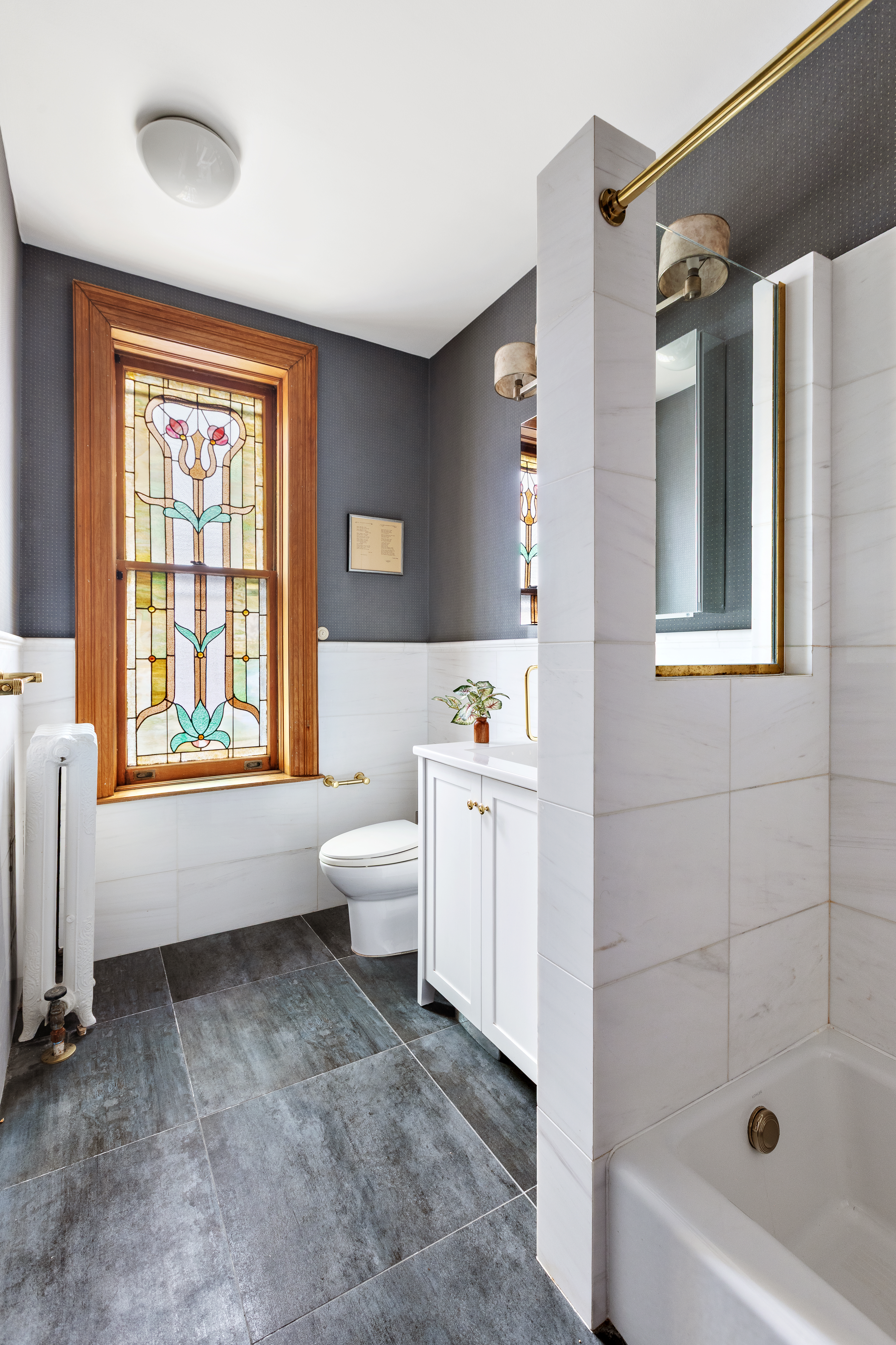 623 2nd Street Brooklyn, NY 11215 - Photo 9 of 26 a bathroom with a bathtub sink and toilet