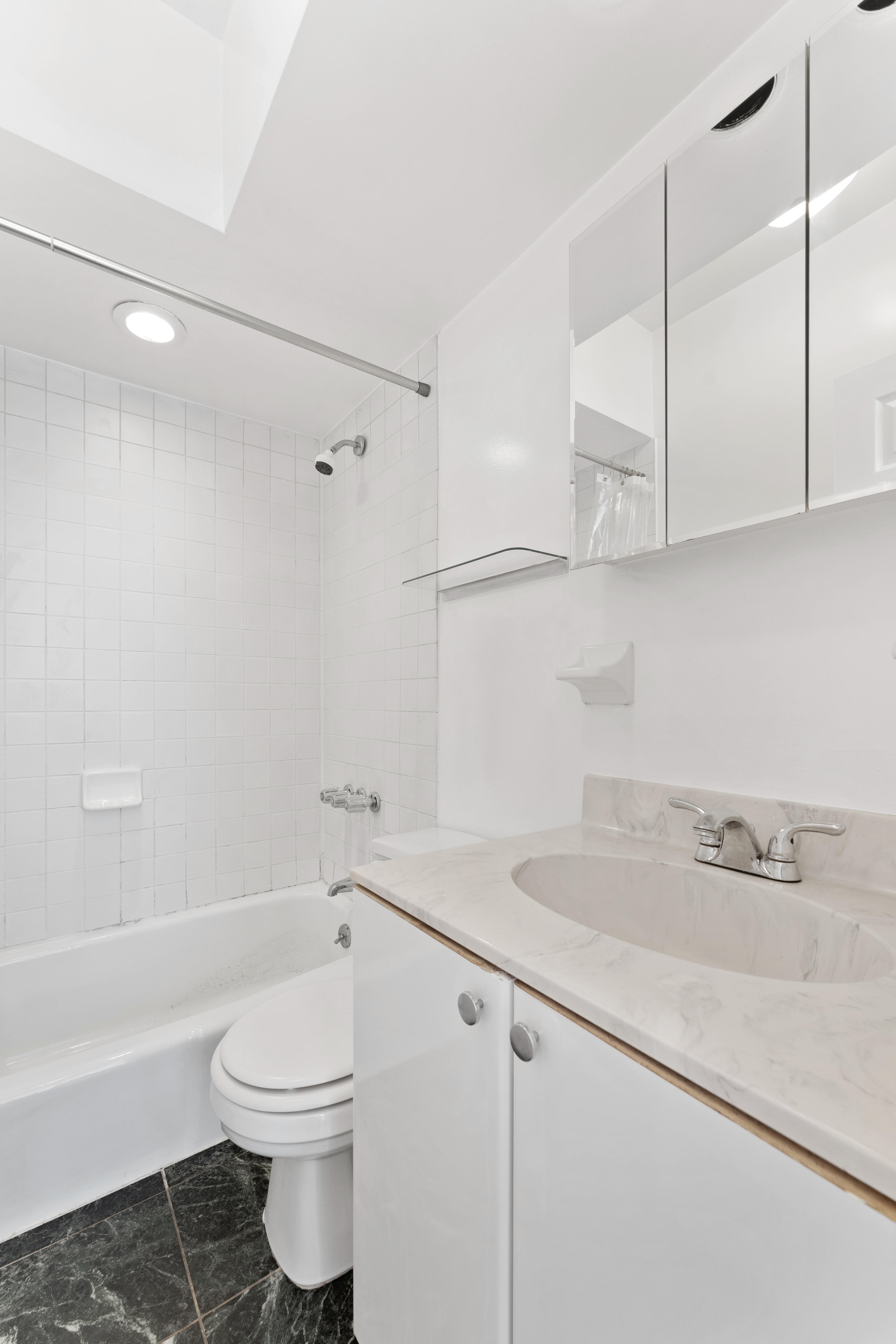 353 12th Street, Unit 3 Brooklyn, NY 11215 - Photo 5 of 13 a bathroom with a sink a toilet and bathtub