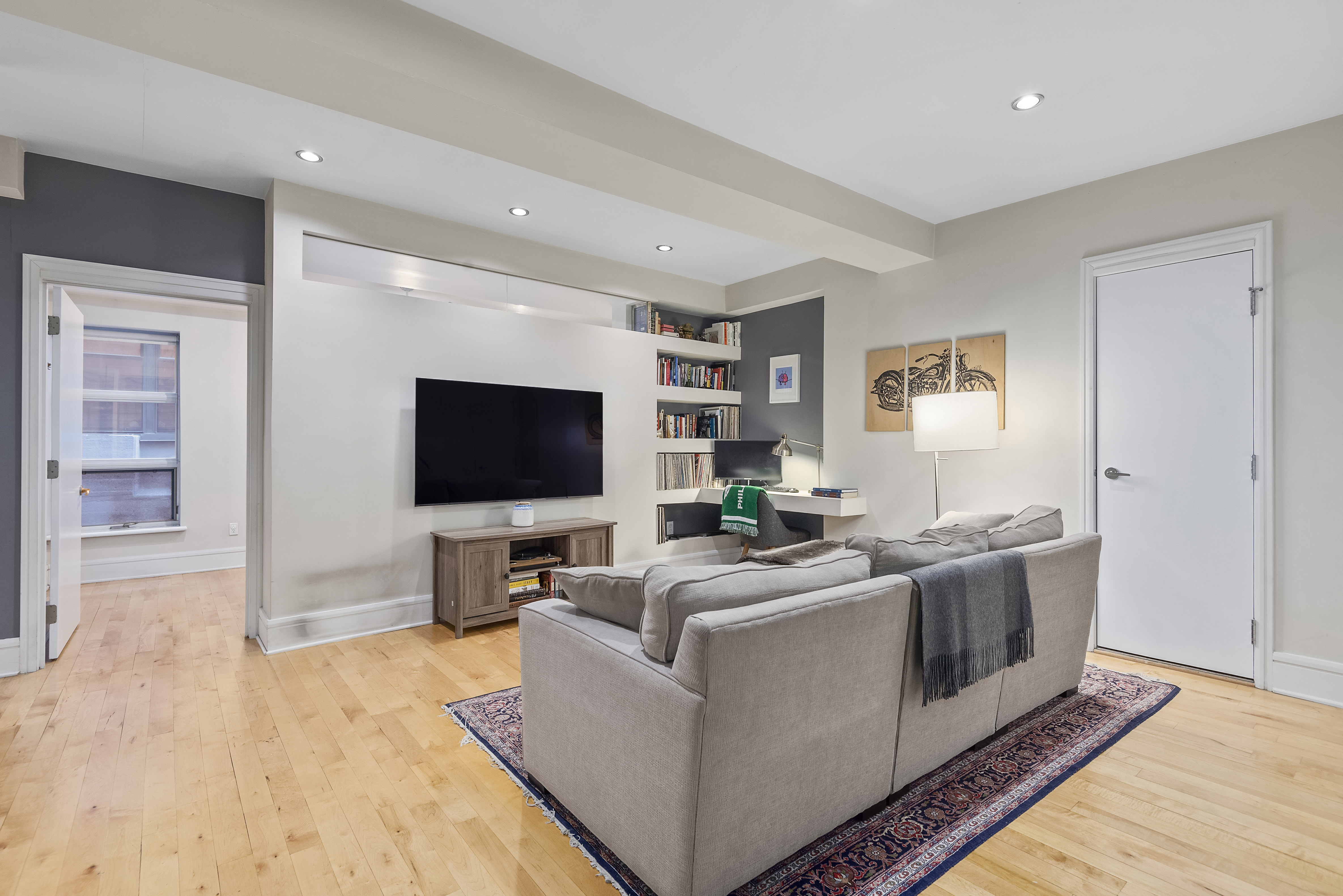 a living room with furniture and a flat screen tv