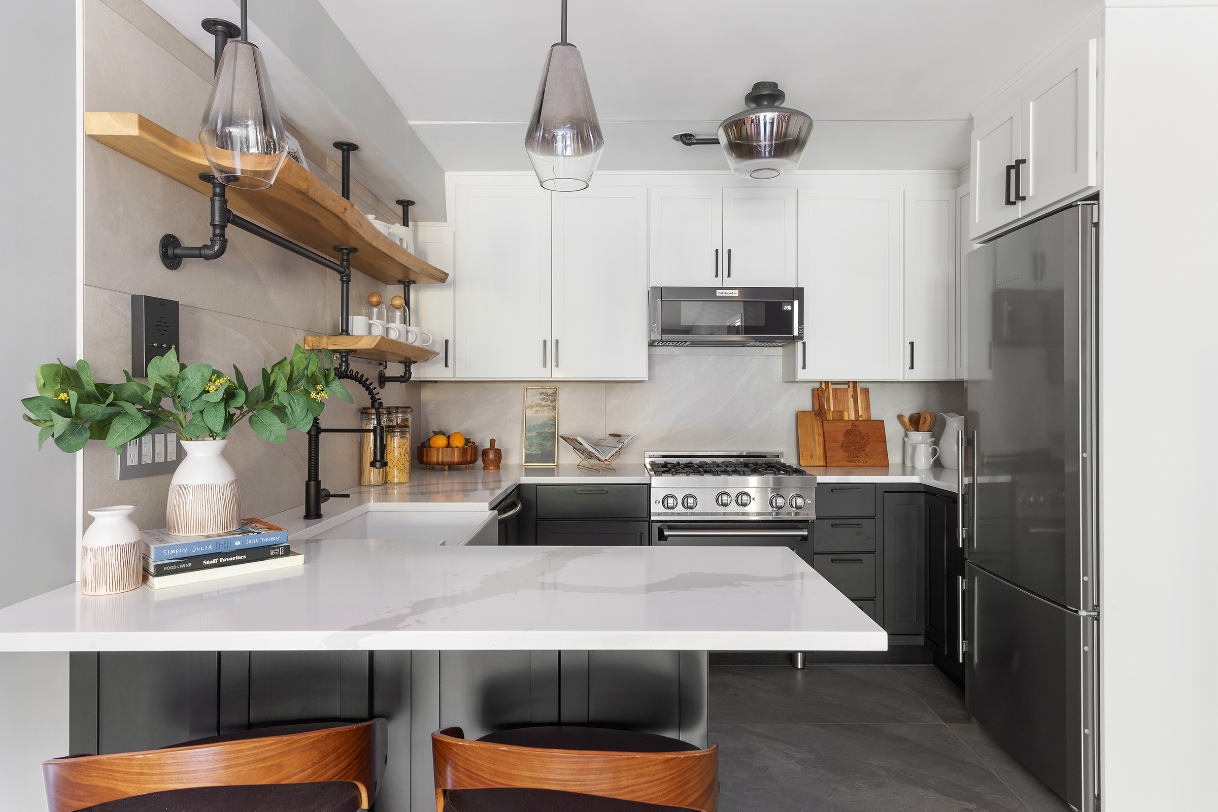 113 Prospect Park Southwest, Unit 12 Brooklyn, NY 11218 - Photo 4 of 13 a kitchen with stainless steel appliances granite countertop a sink a stove and a refrigerator