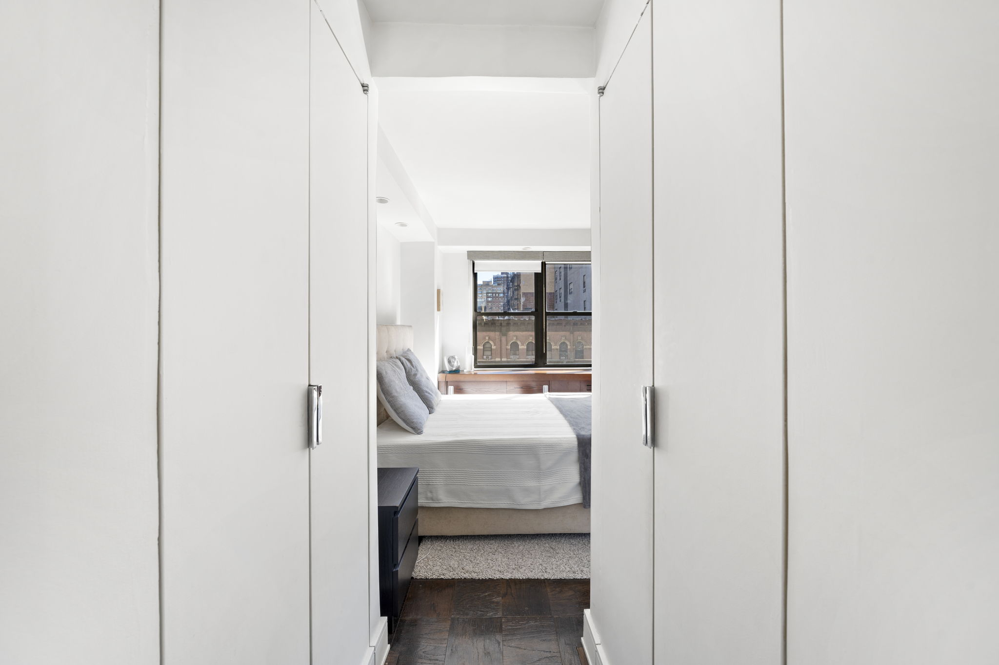 330 3rd Avenue, Unit 8D Manhattan, NY 10010 - Photo 9 of 11 a bedroom with a bed and a window