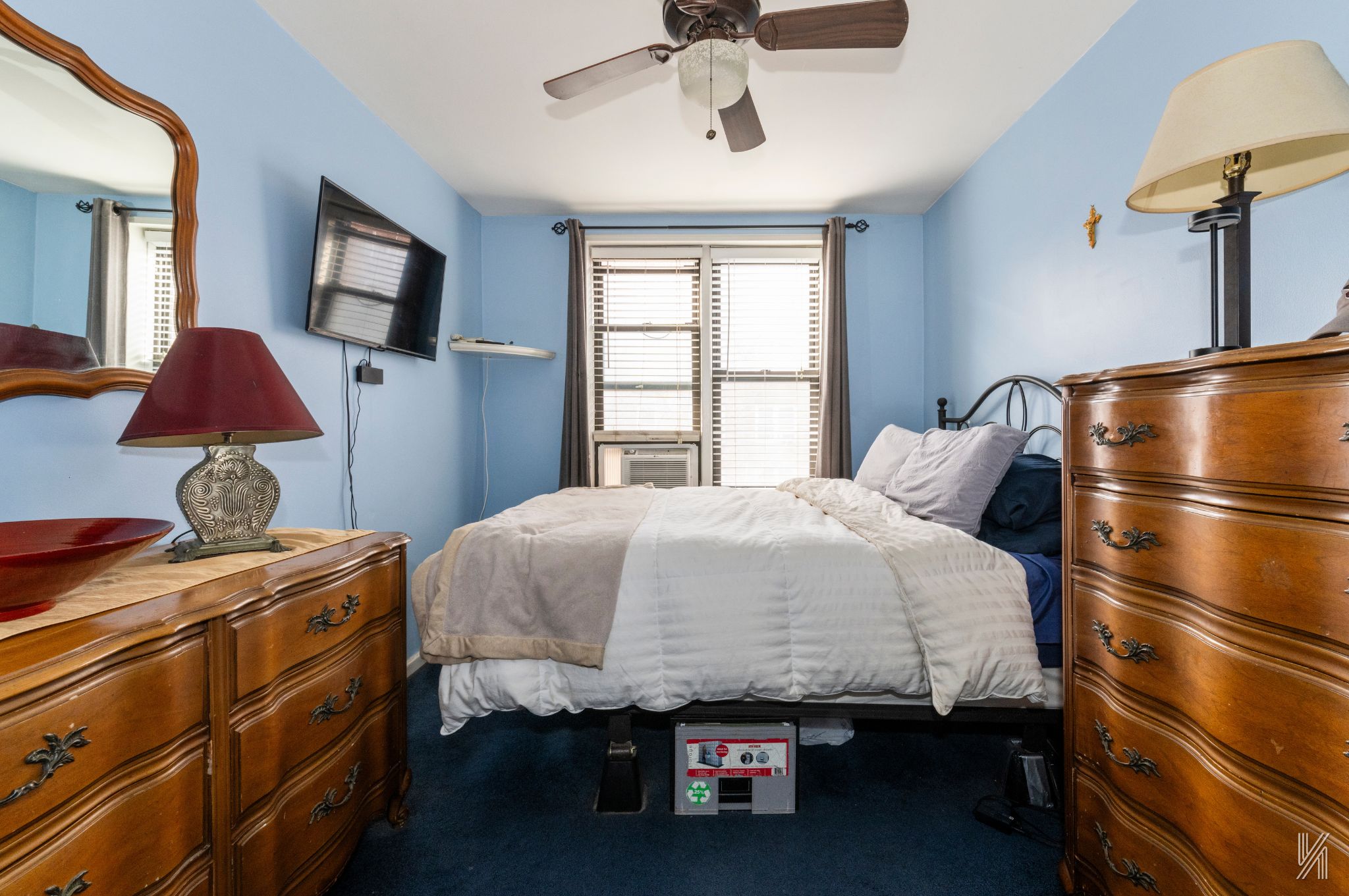 33-27 91st Street, Unit 3J Queens, NY 11372 - Photo 8 of 13 a bed room with a bed and a tv