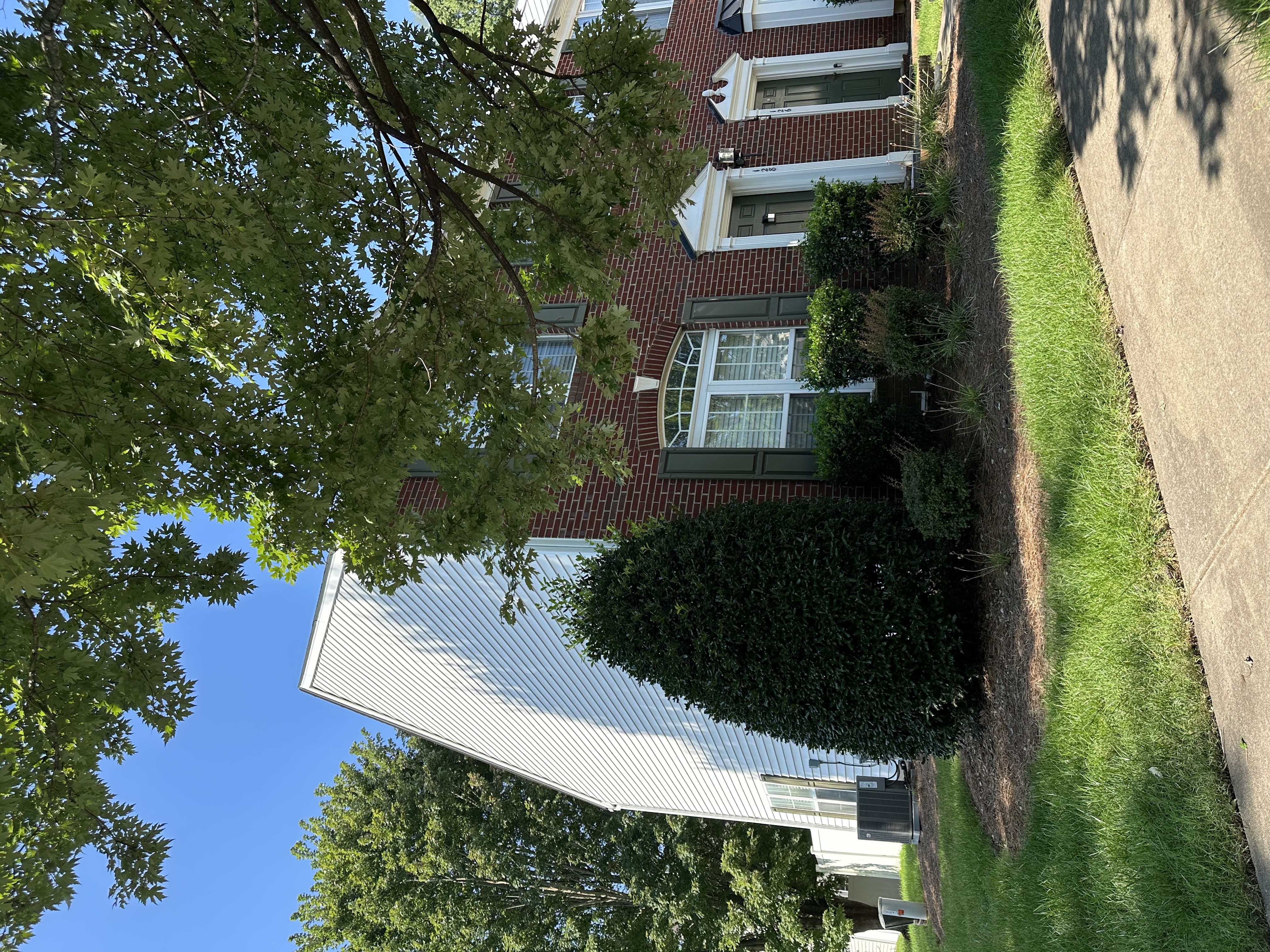 128 Talbert Town Loop, Unit Undisclosed Mooresville, NC 28117 - Photo 2 of 3 a view of a house with a yard and a large tree