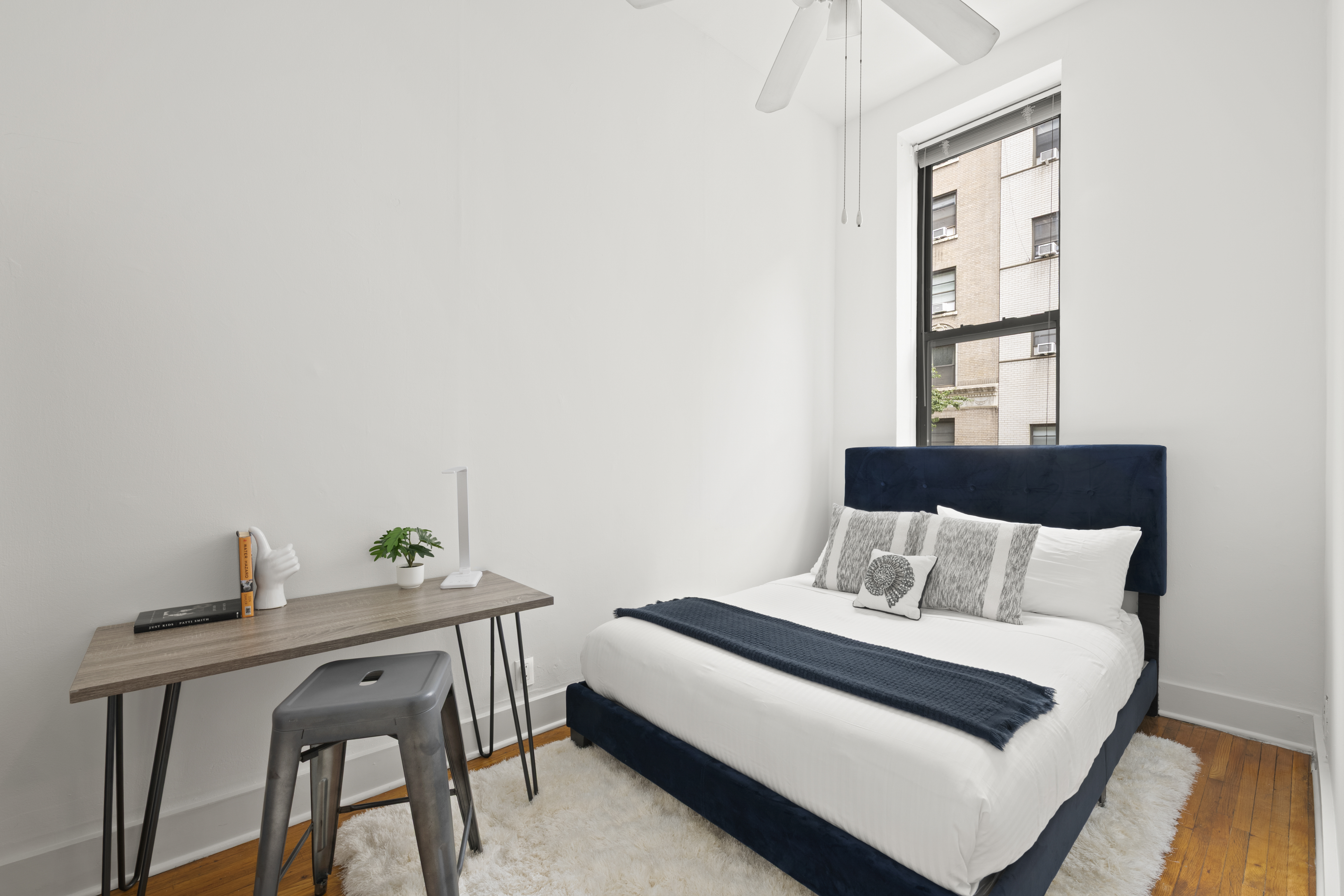 132 West 71st Street, Unit 3 Manhattan, NY 10023 - Photo 5 of 7 a bedroom with a bed and a window