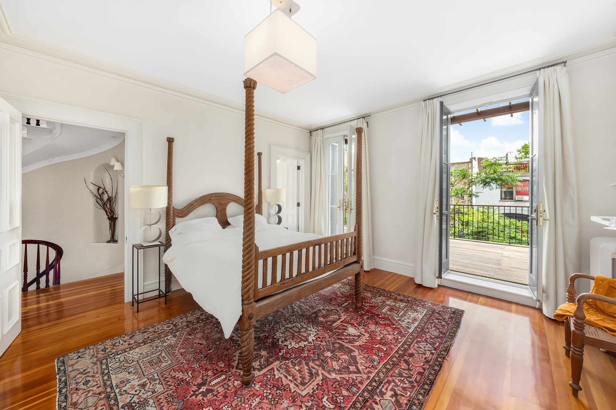 128 State Street, Unit 2 Brooklyn, NY 11201 - Photo 10 of 15 a view of a bedroom with wooden floor & a rug
