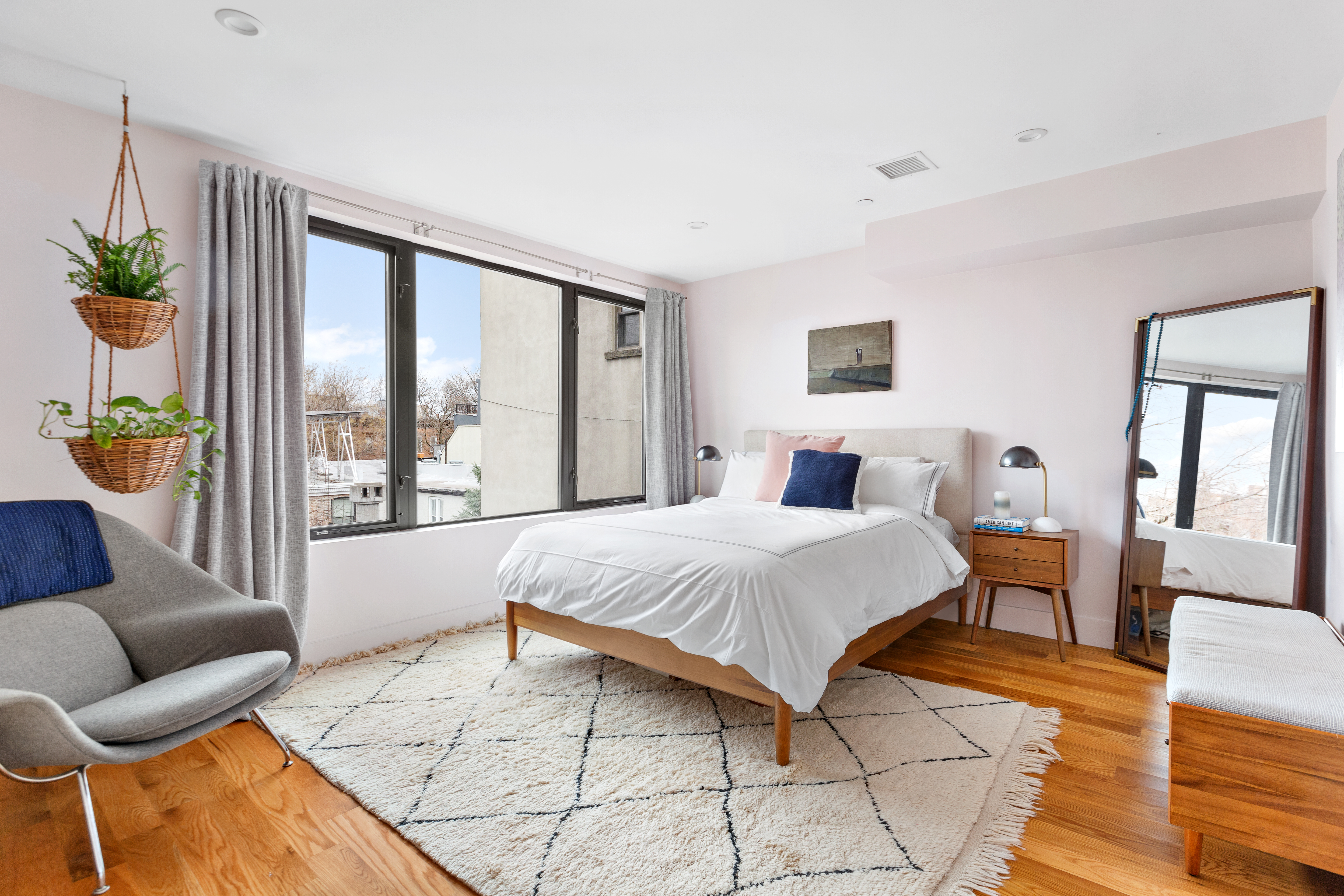 39 Madison Street, Unit 3B Brooklyn, NY 11238 - Photo 10 of 16 a bedroom with a large bed and a large window