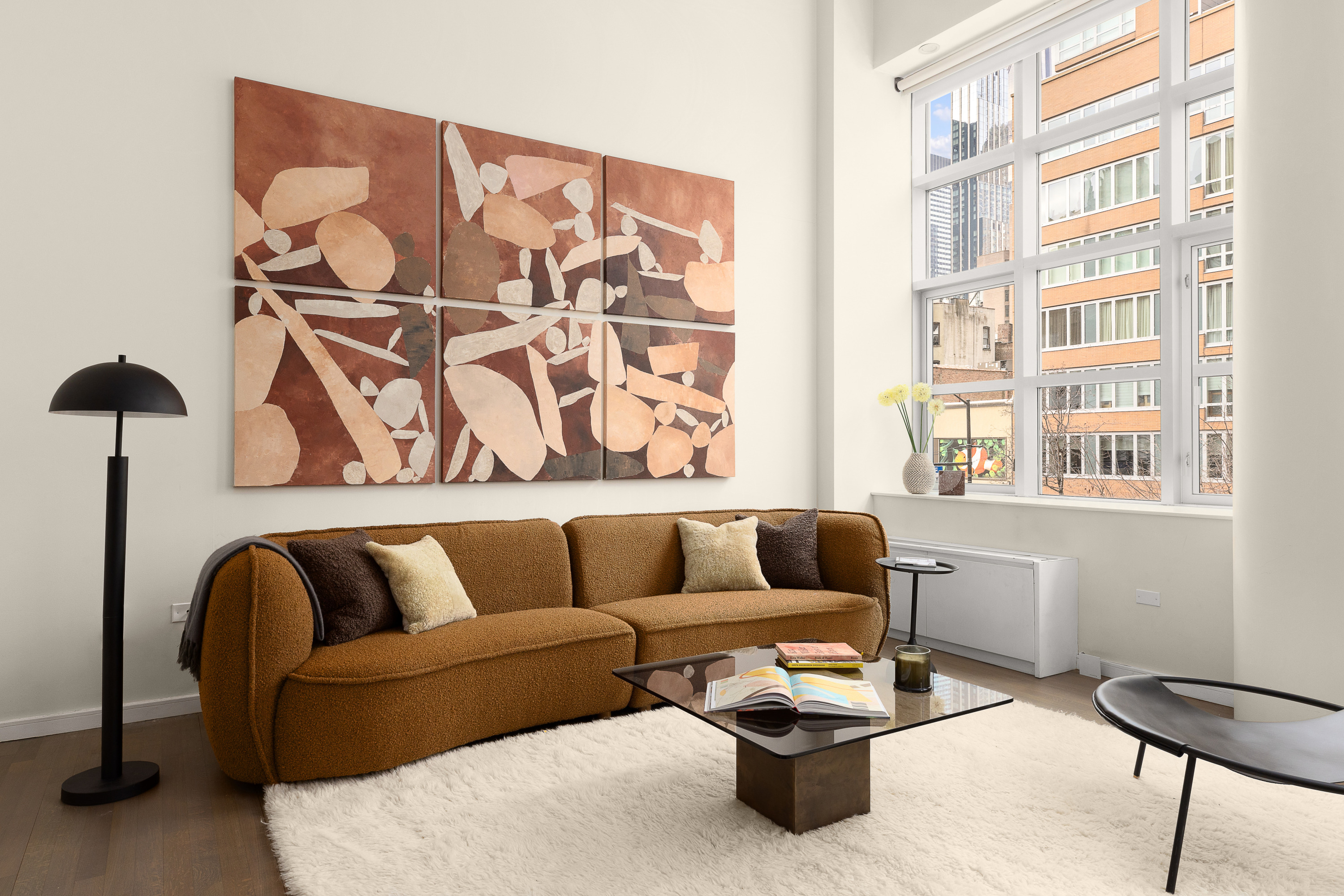 310 East 53rd Street, Unit 2/3D Manhattan, NY 10022 - Photo 4 of 13 a living room with furniture and a window