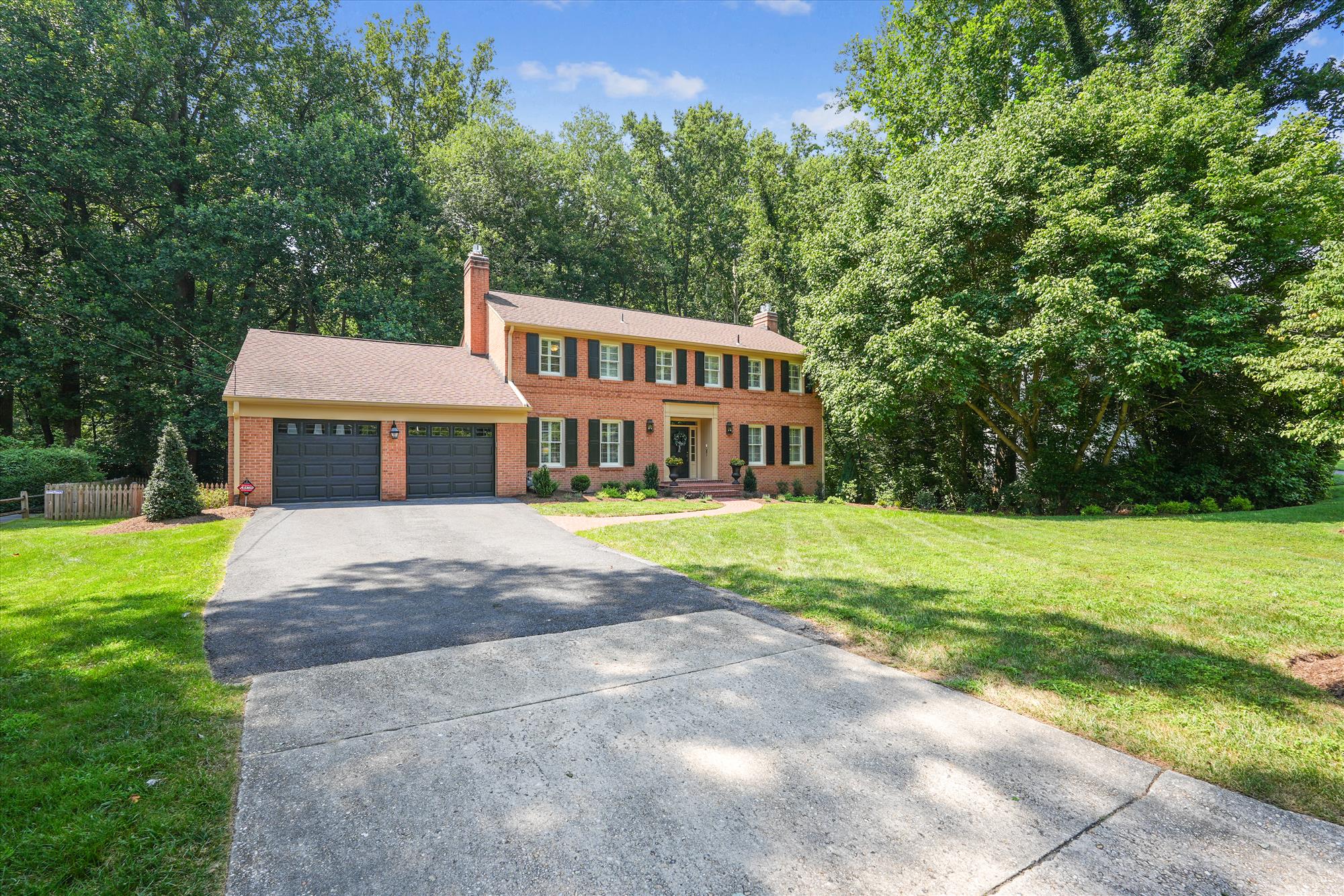 9904 Carter Road Bethesda, MD 20817 - Photo 2 of 41 a front view of a house with garden