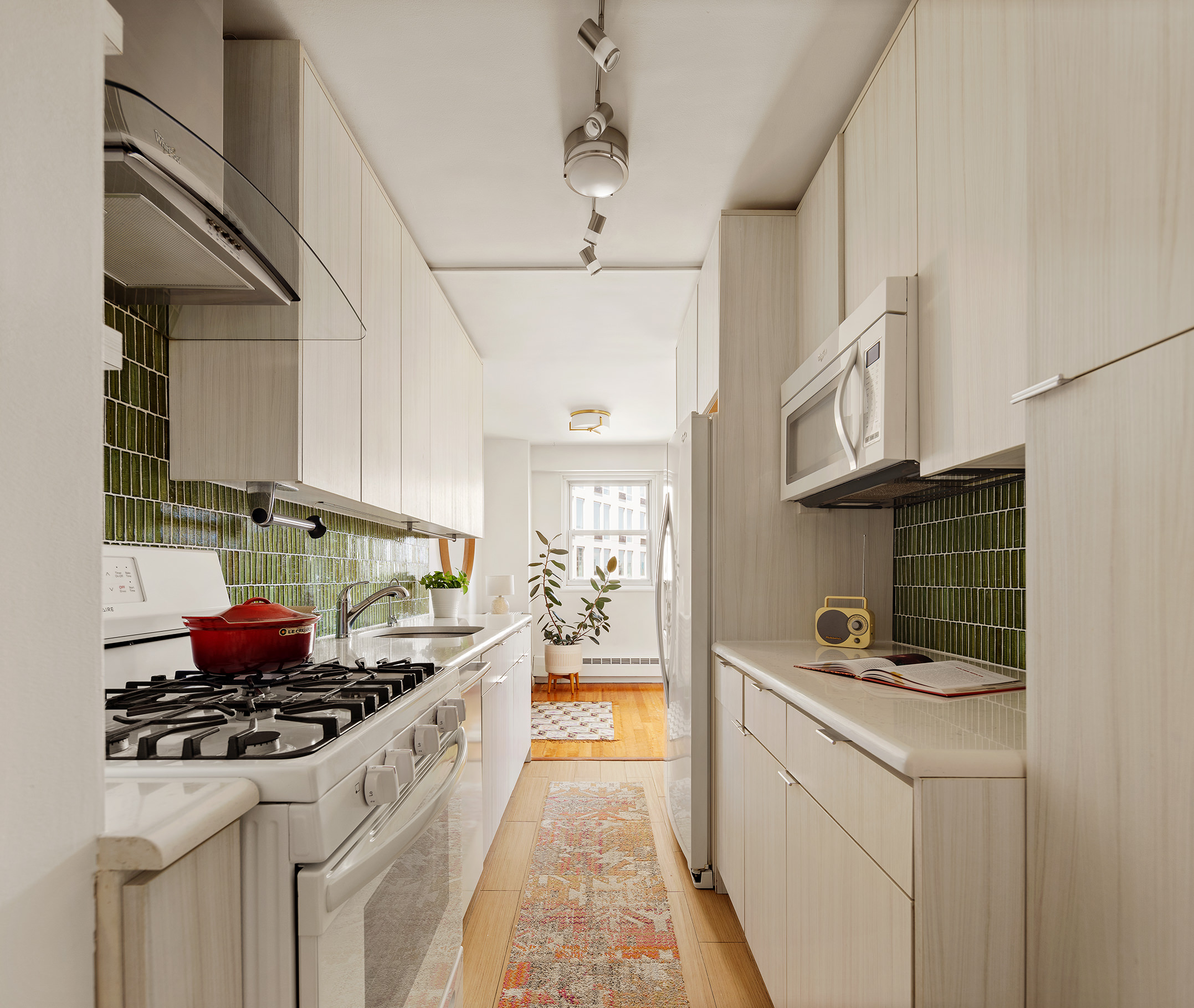 175 Willoughby Street, Unit 11L Brooklyn, NY 11201 - Photo 3 of 16 a kitchen with stainless steel appliances granite countertop a stove and a sink