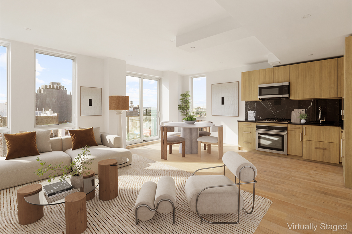 a living room with furniture a large window and a fireplace
